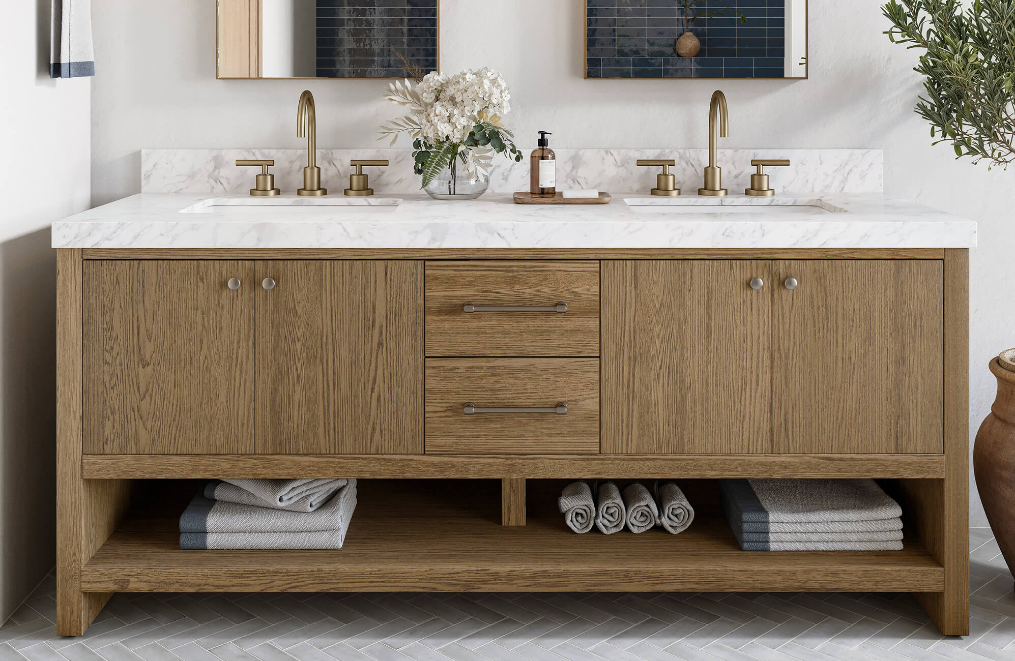null Modern oak double-sink vanity with a marble countertop, brass fixtures, and open shelving neatly stacked with towels.