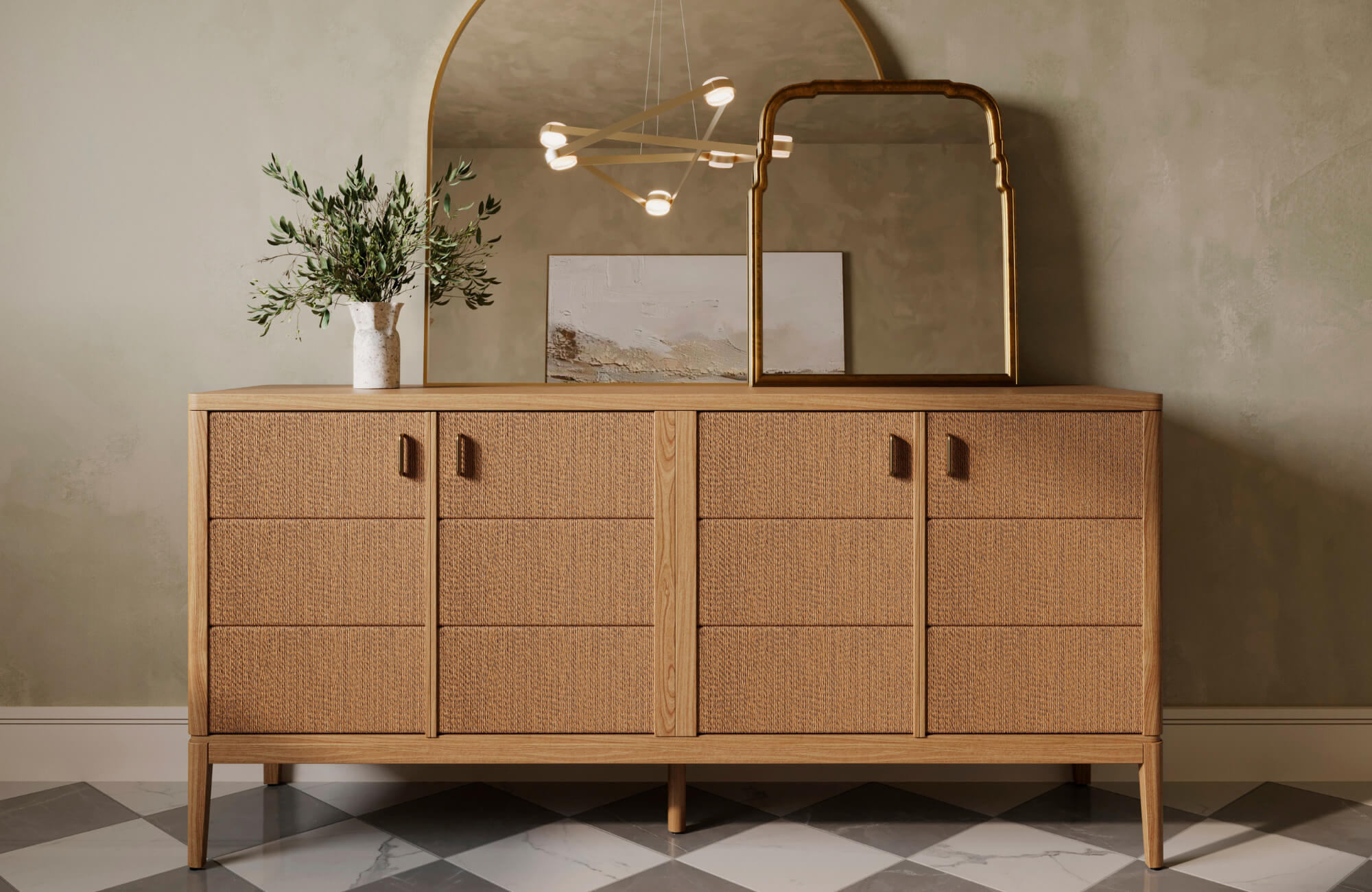 Light wood sideboard styled with greenery and an arched mirror, featuring layered décor in a soft, serene room.