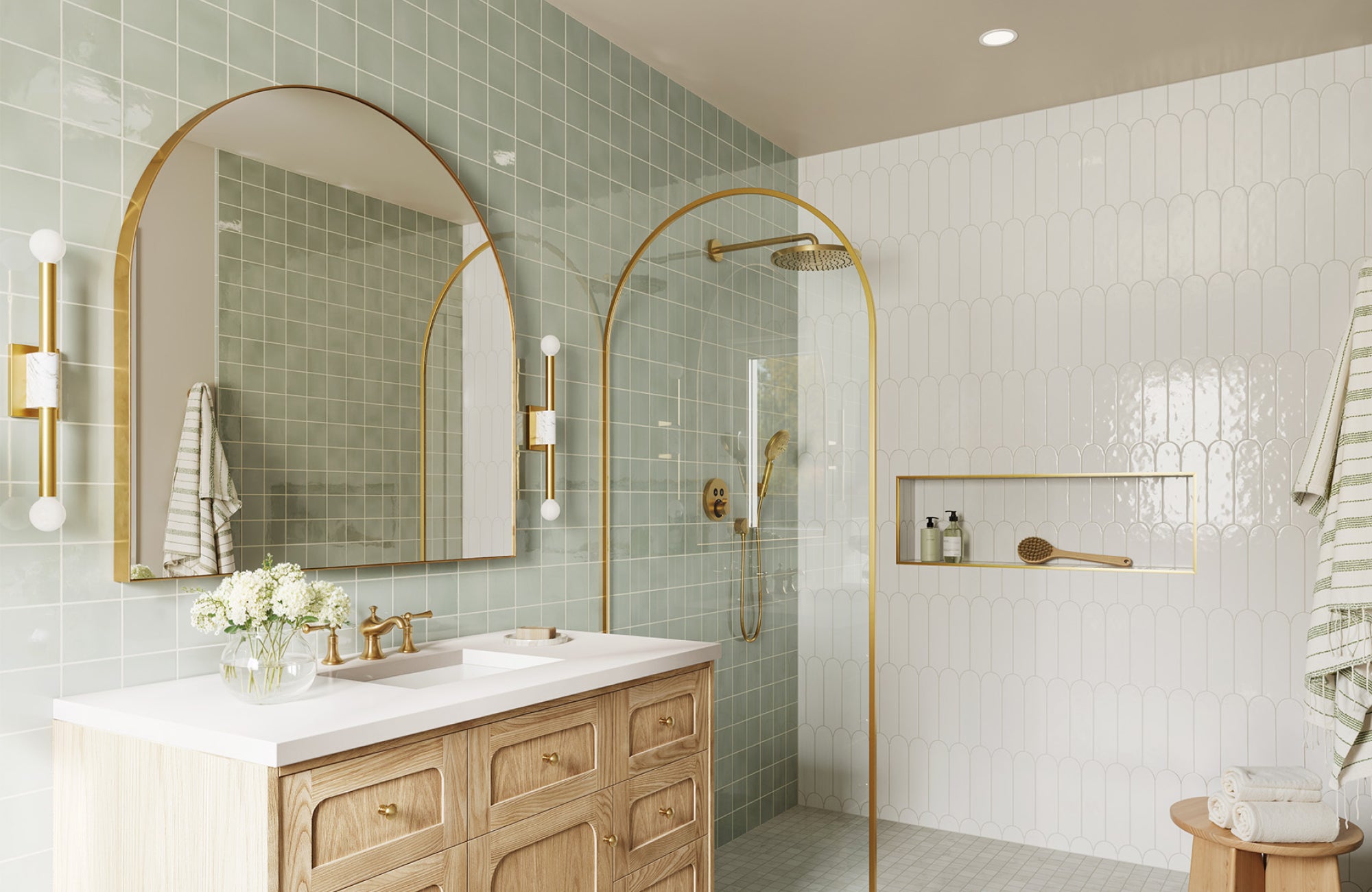 Arch mirror placed just above faucet height, with sconces aligned to balance height and maintain symmetry.