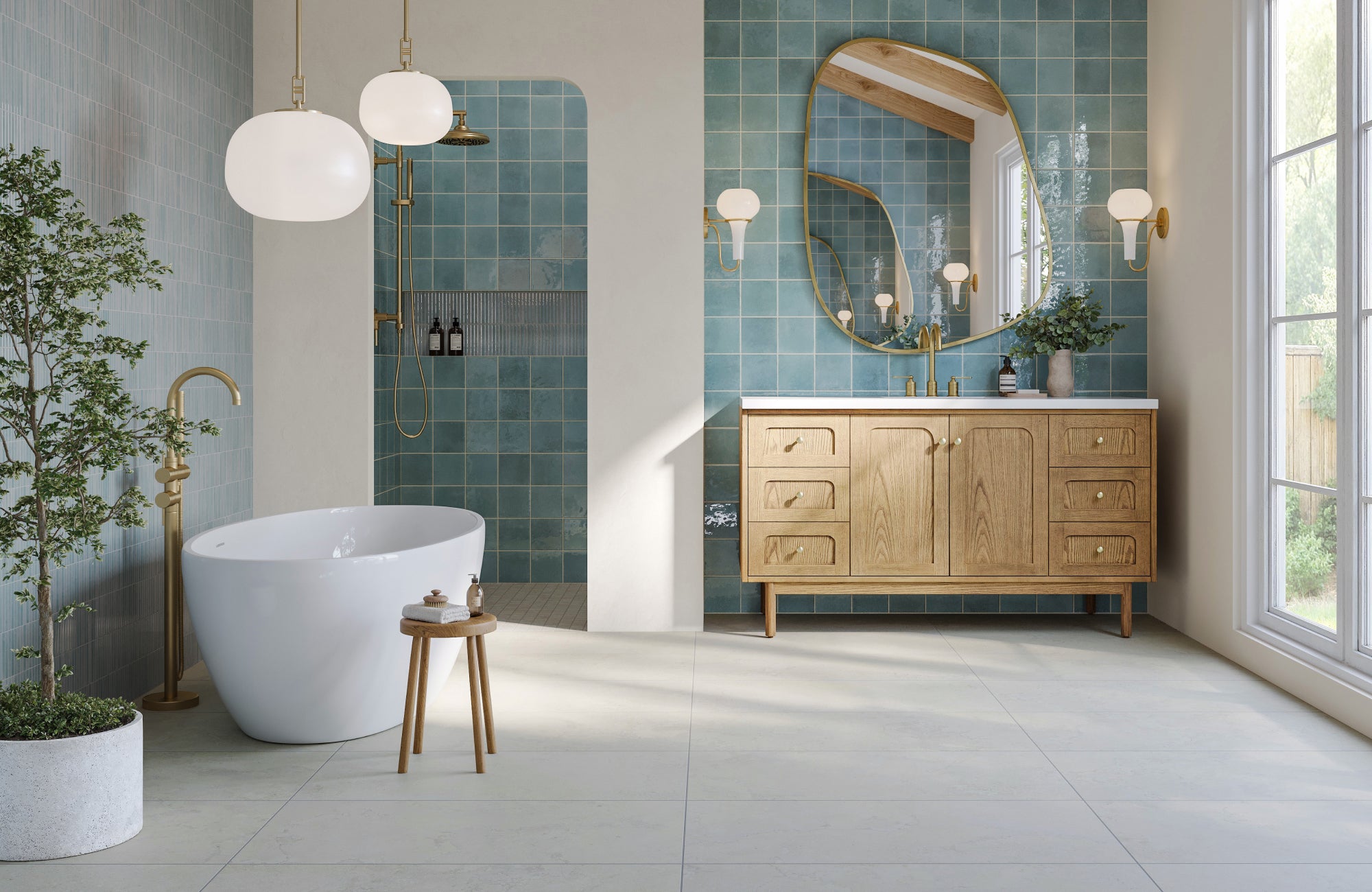 Asymmetrical mirror hung just above faucet line, paired with sconces for a modern, elevated placement.
