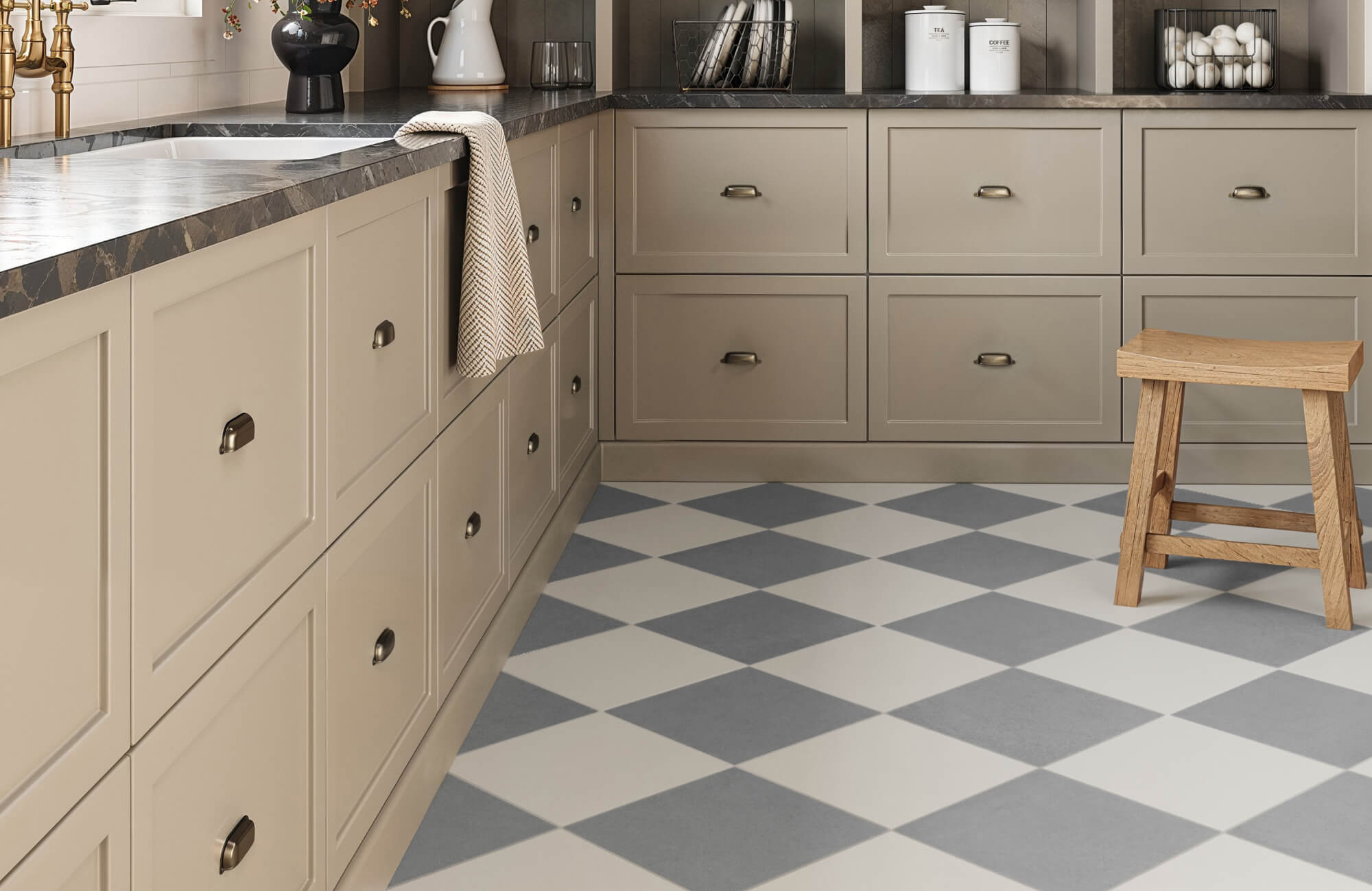 null Charming kitchen with soft taupe cabinetry, a dark stone countertop, and a classic checkered floor for a timeless appeal.