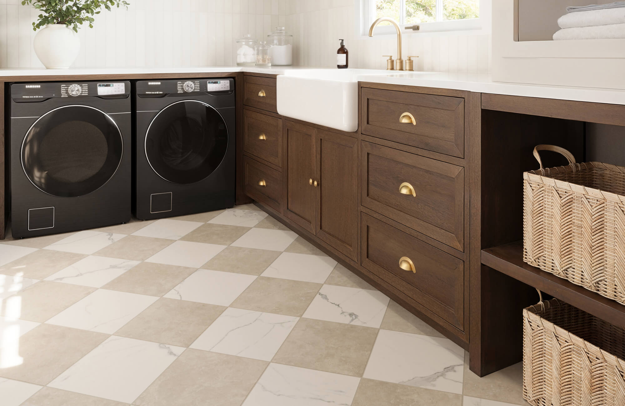 null Elegant laundry room with rich wood cabinetry, gold hardware, and a beige and white checkered marble floor, blending style and function.