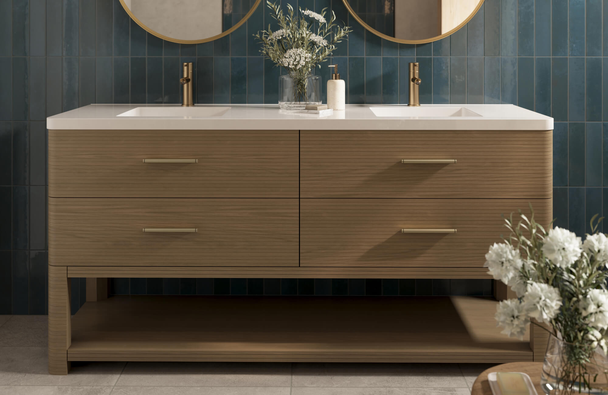 Sleek wood vanity with gold hardware contrasts beautifully against deep teal vertical tile walls and stone-look floors.