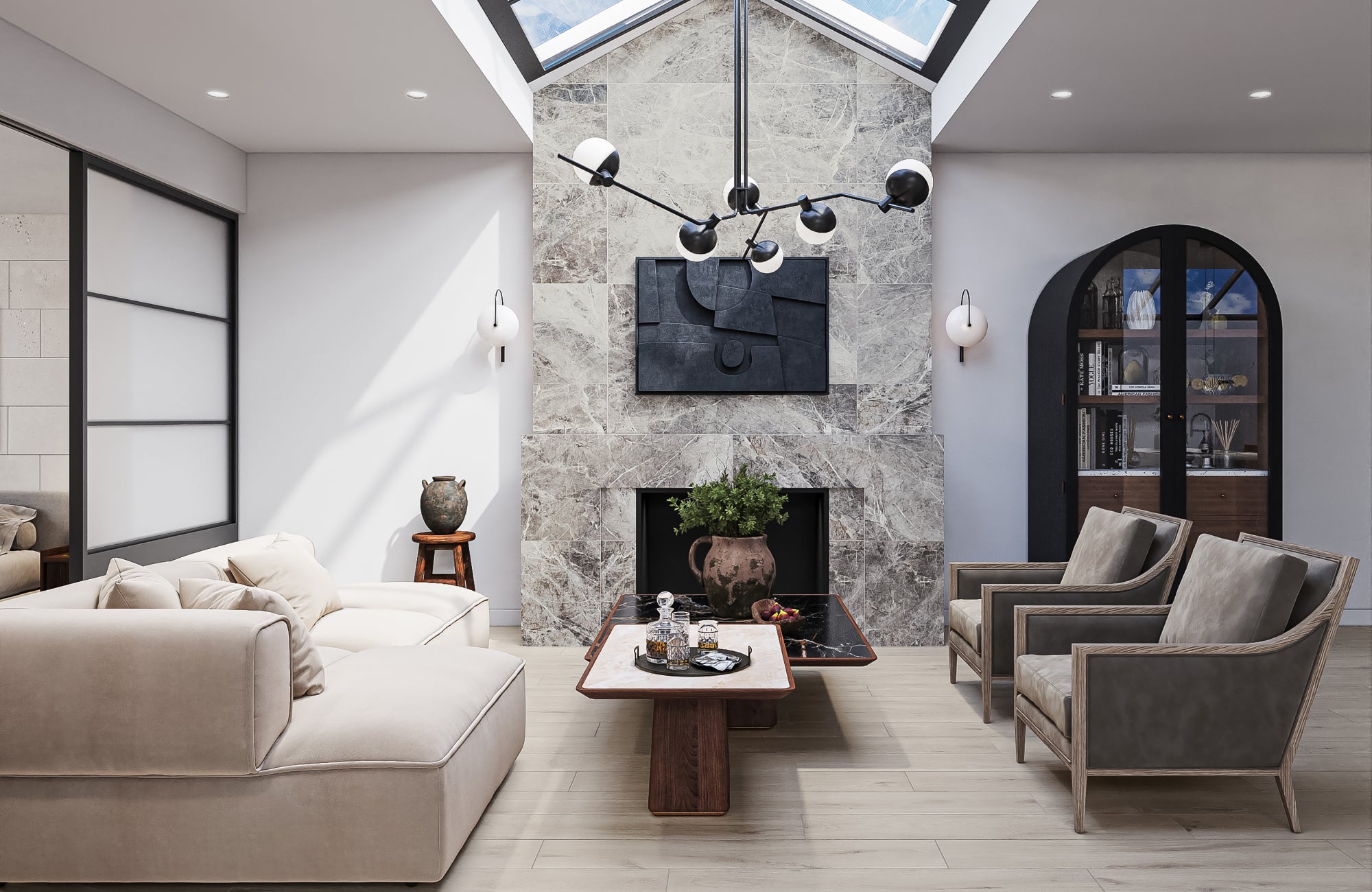 null Multi-arm chandelier and round sconces layer ambient and accent lighting in a living room with skylight and stone fireplace.
