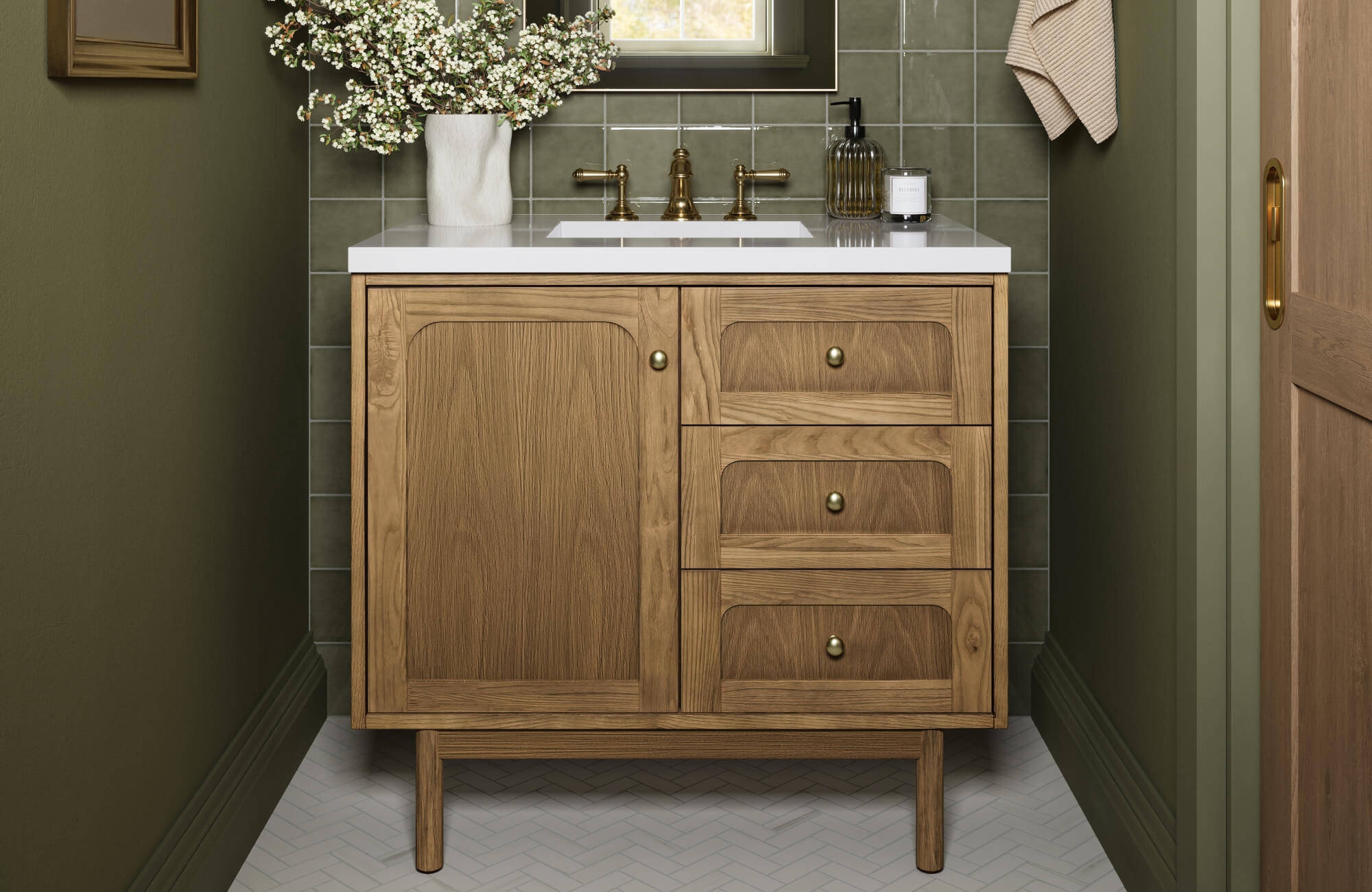 null Glossy olive green square tile backsplash adds depth behind a warm wood vanity with brass fixtures and hardware.
