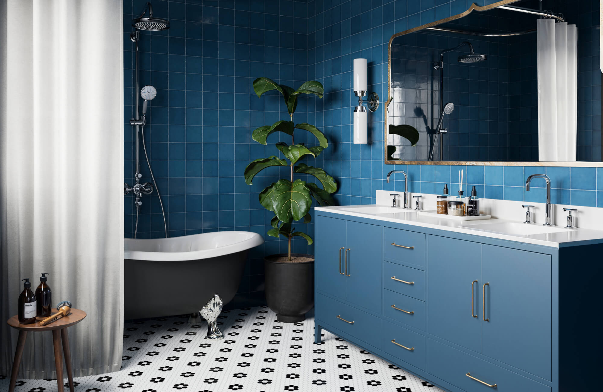 null Deep blue tiles cover the bathroom walls, pairing with a blue vanity, white sinks, and a freestanding tub for a rich, layered look.