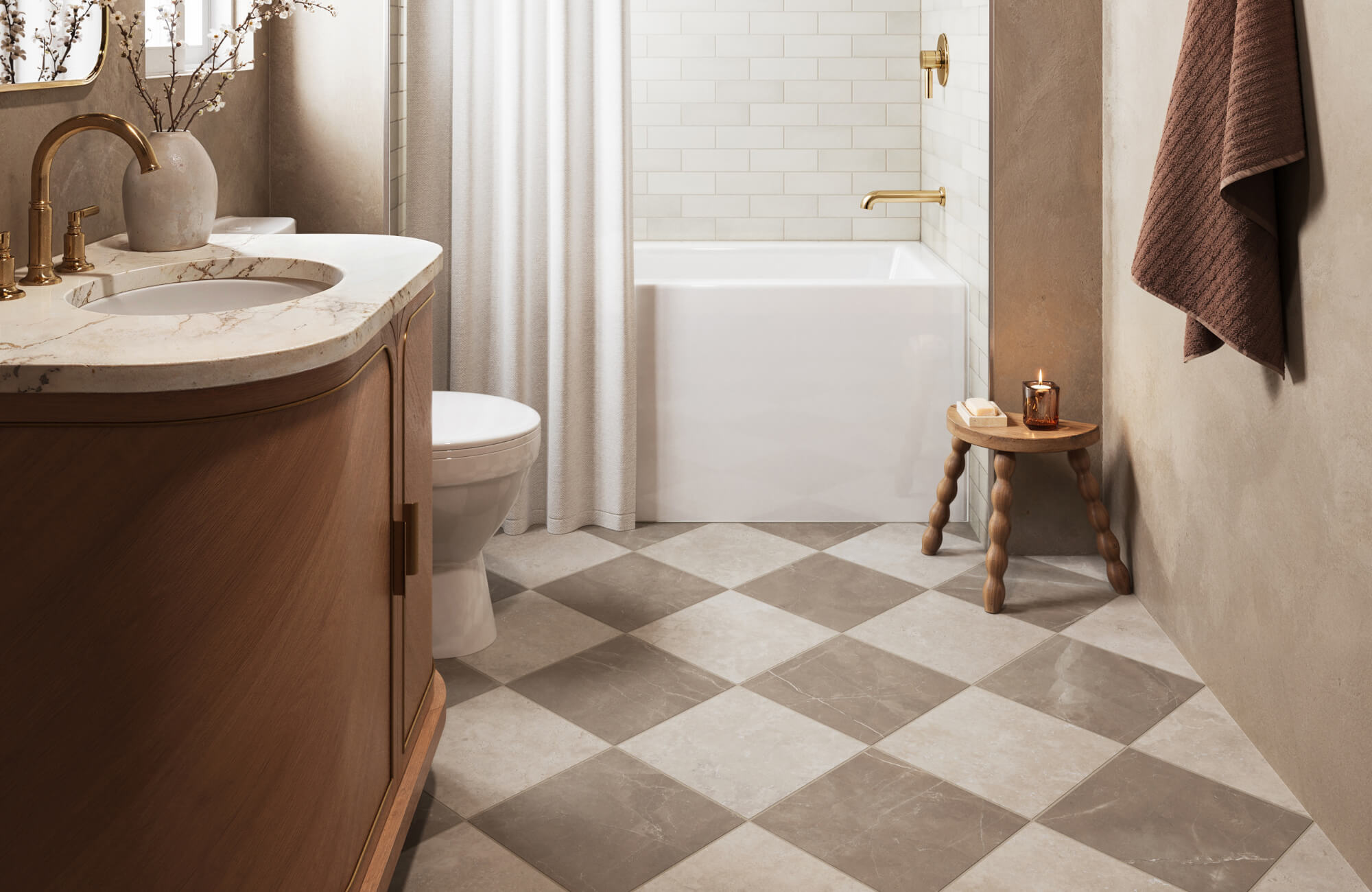 null Elegant bathroom featuring taupe and beige checkerboard floor tiles, a marble vanity, gold fixtures, and a white bathtub with tile surround.