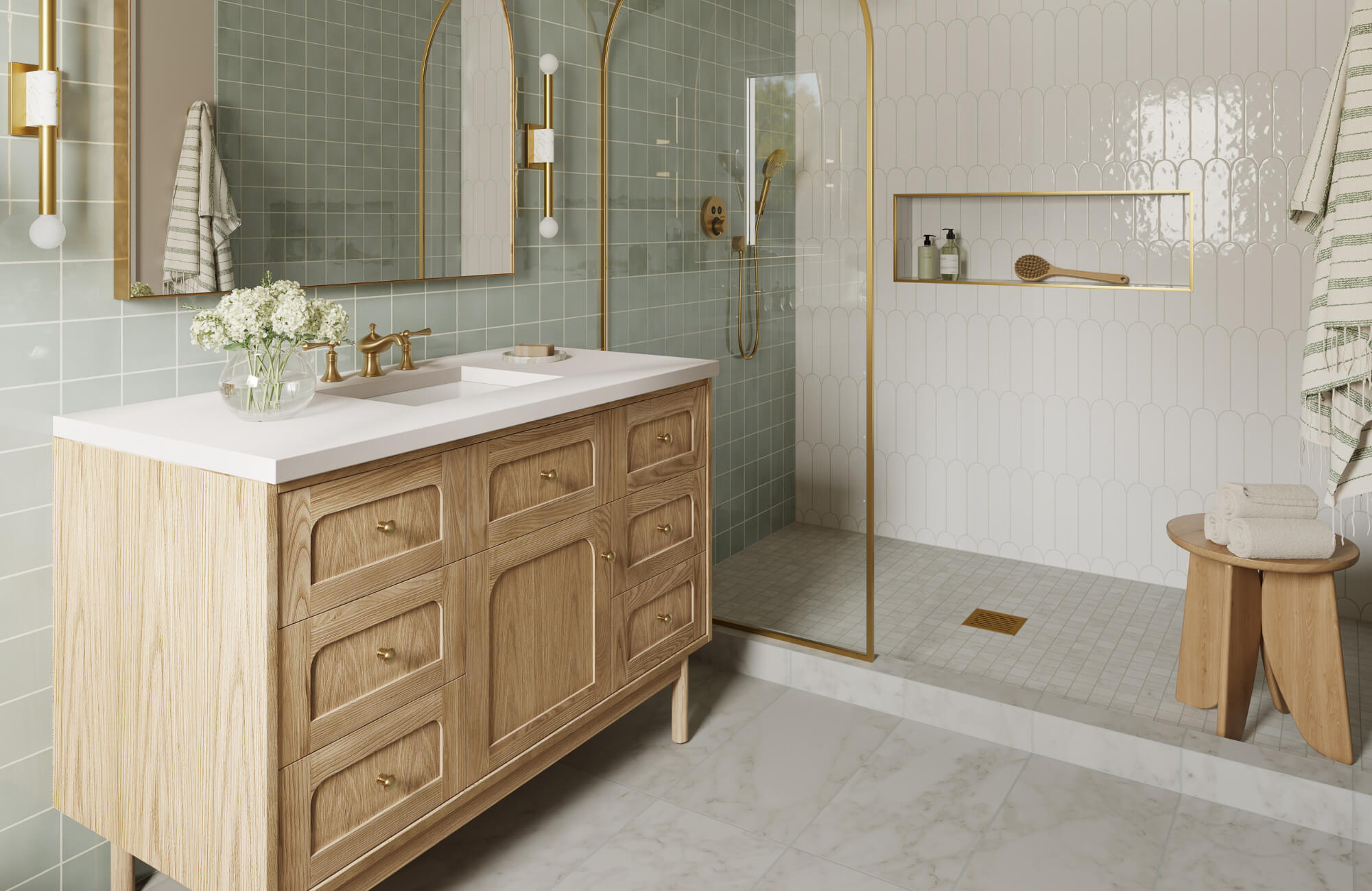 Modern bathroom with light wood vanity, gold fixtures, large mirror, glass shower enclosure, and decorative wall tiles.