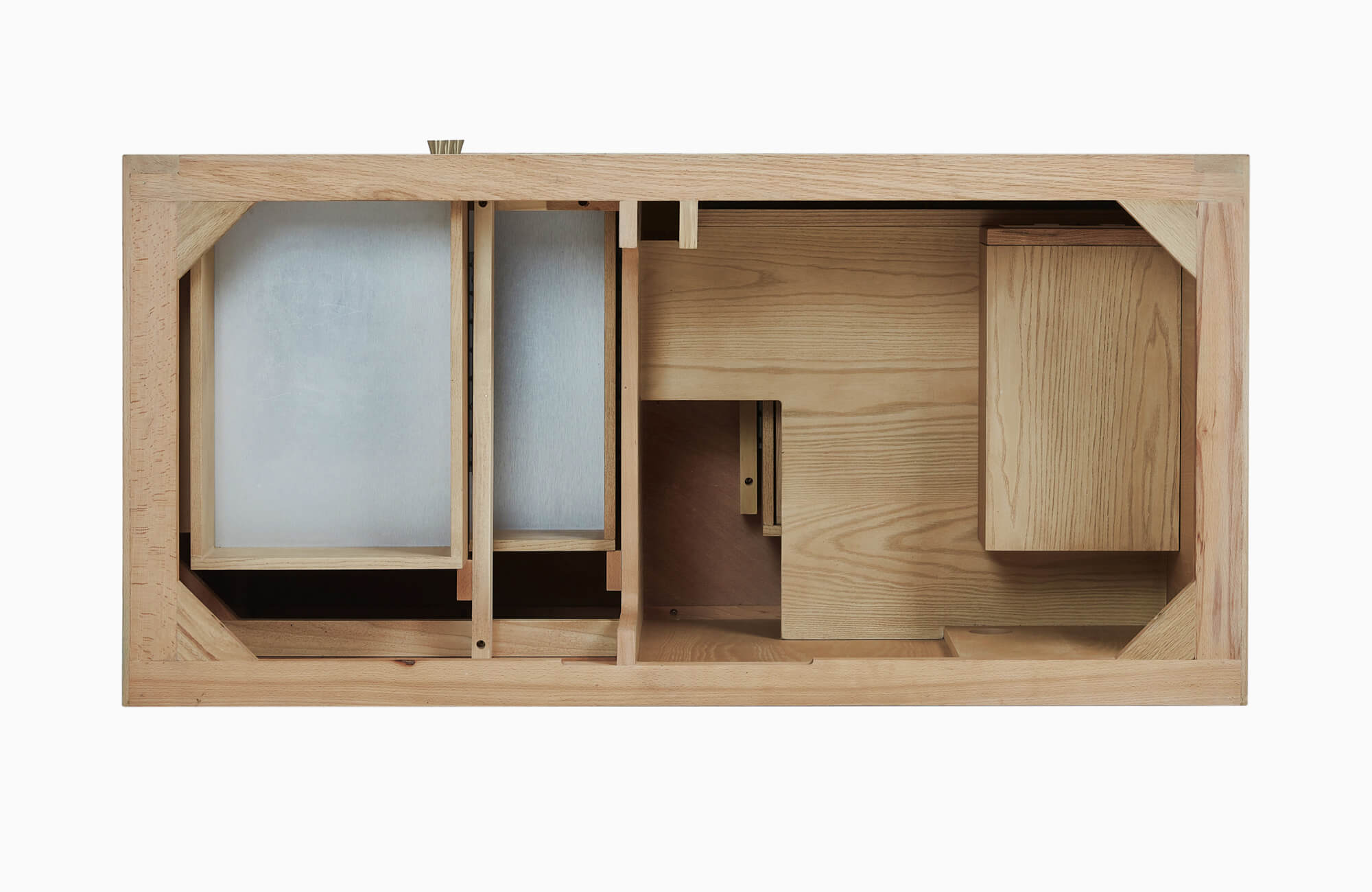 Overhead view of wooden bathroom vanity frame showing internal compartments, support structures, and unfinished construction.