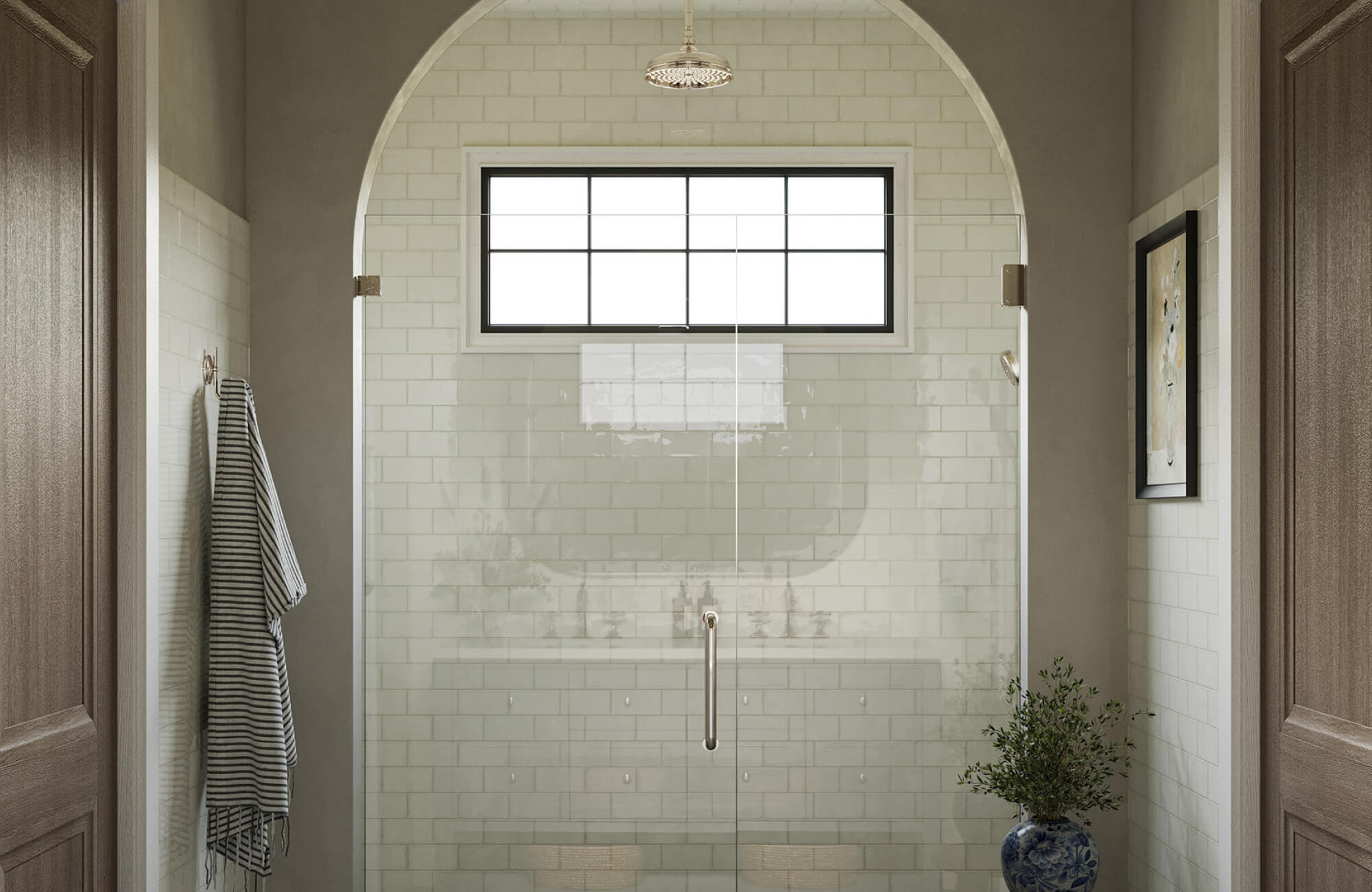 White shower tiles with a glossy finish reflect daylight softly, helping the space stay fresh-looking with minimal maintenance.