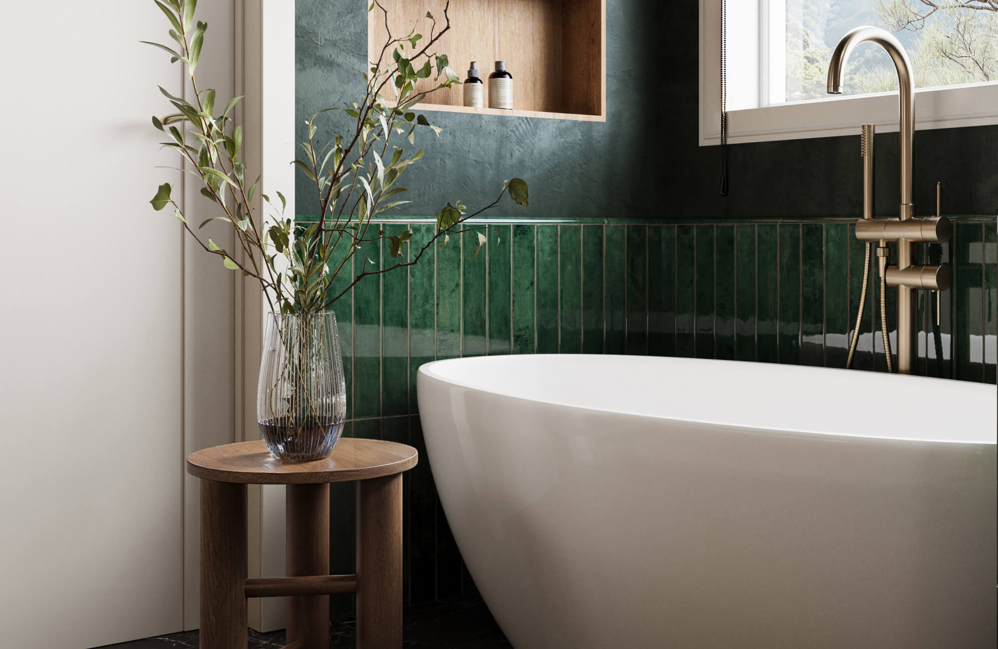 Serene bathroom with green subway tiles with cove base trims, a freestanding white tub, brushed brass fixtures, and natural wood accents.