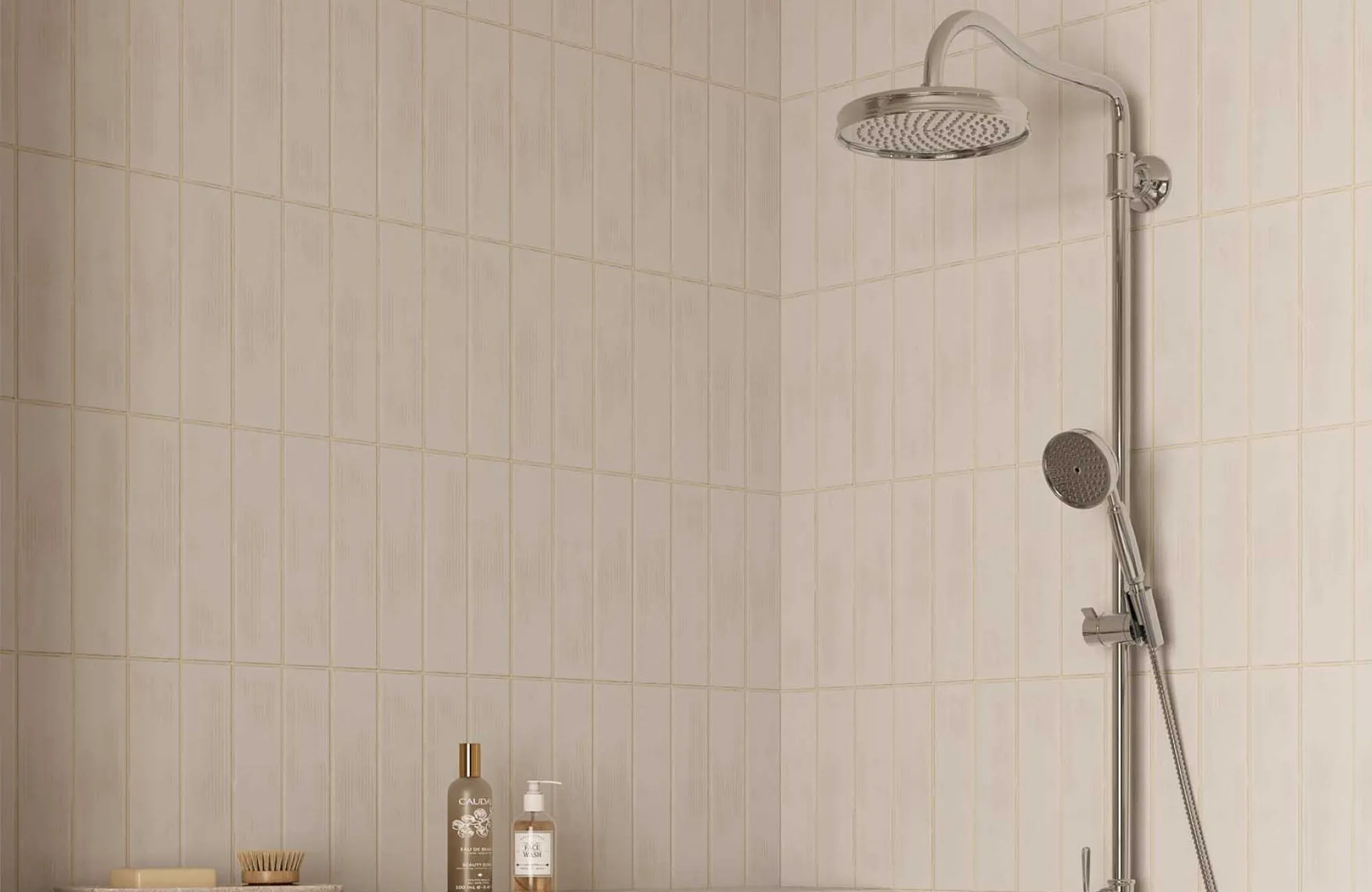 Shower walls clad in vertically stacked, 3z12 subway tiles, demonstrating how elongated tile sizes can create a taller, more streamlined look in shower spaces.