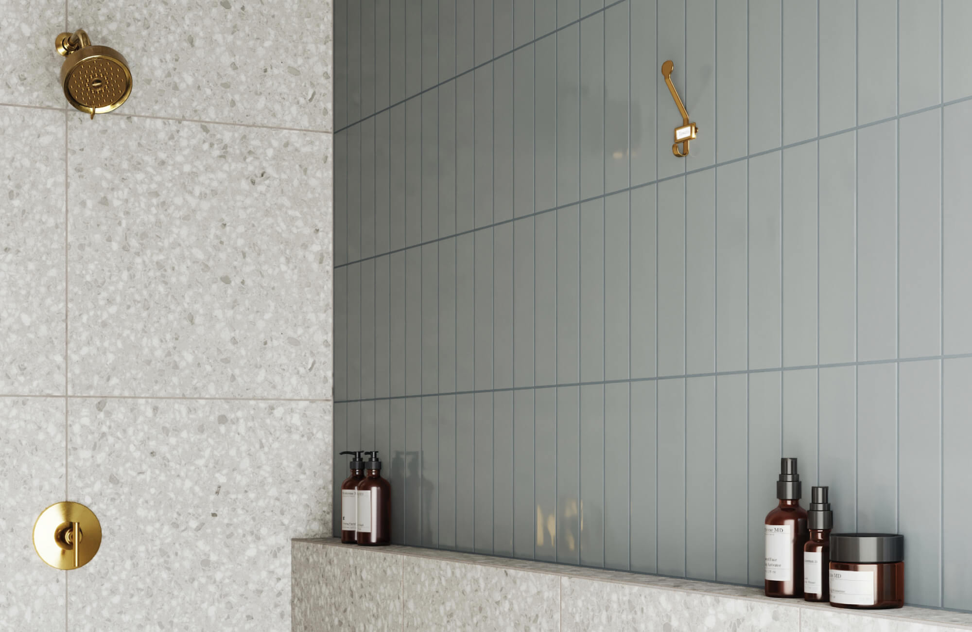 null Elegant shower design featuring terrazzo and soft sage-green vertical subway tiles, accented by luxurious brushed gold fixtures.