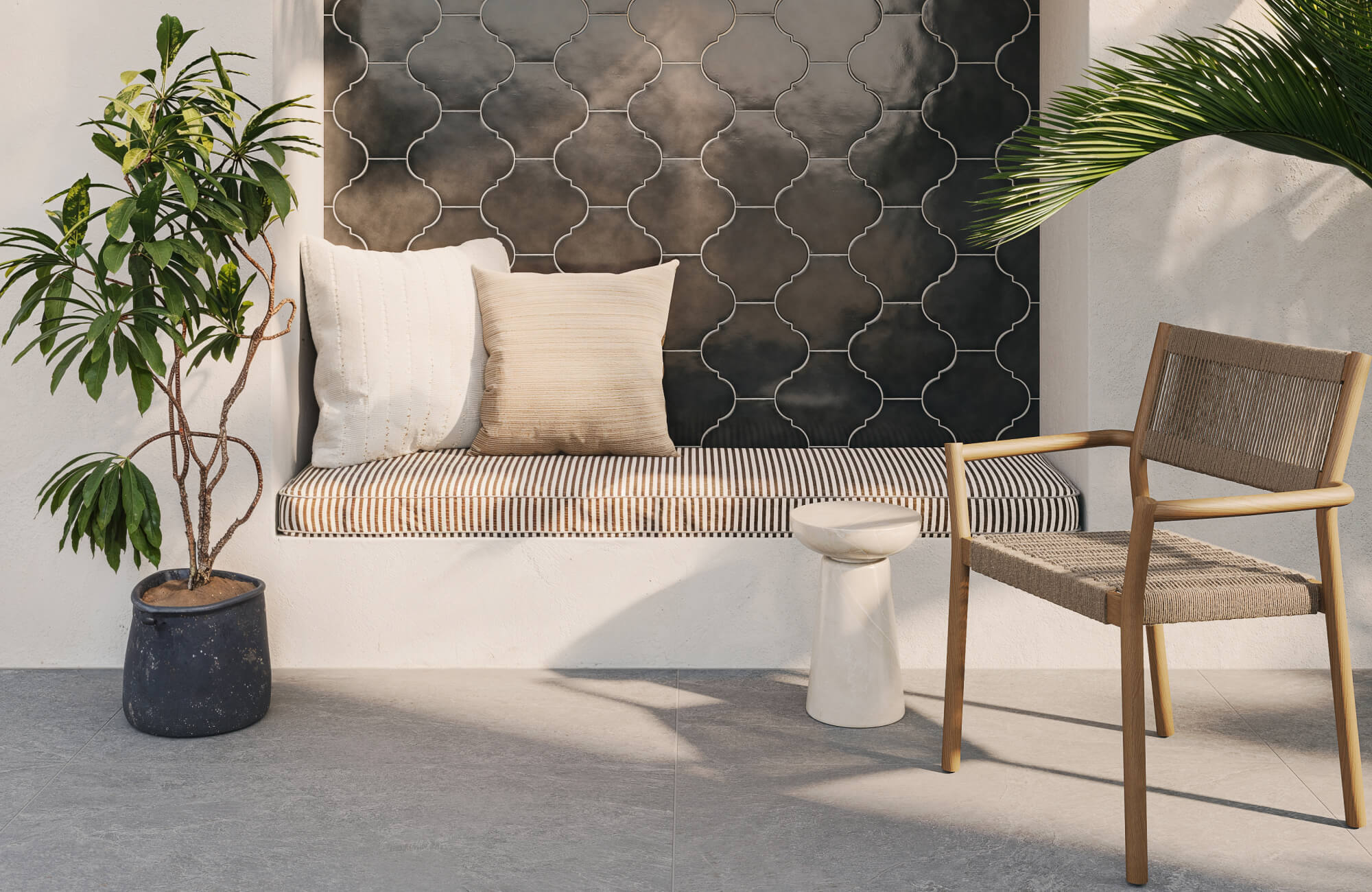 null Built-in outdoor bench with two medium square pillows, demonstrating a simple layered arrangement that adds support while preserving enough sitting space.