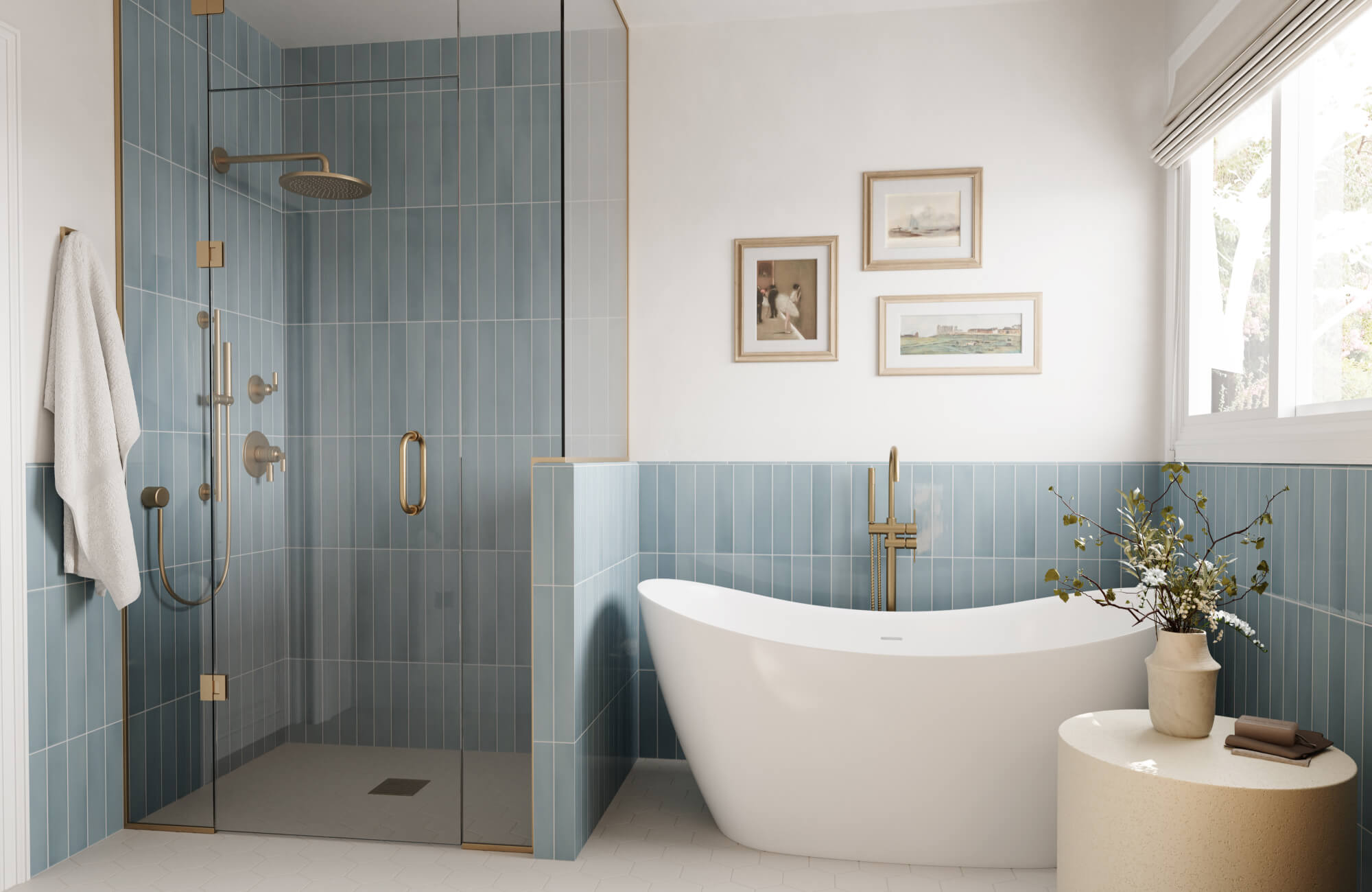 null Serene bathroom with vertical sky blue subway tile, hexagon floor tile, glass shower, freestanding tub, wall art, warm brass fixtures, and large windows.