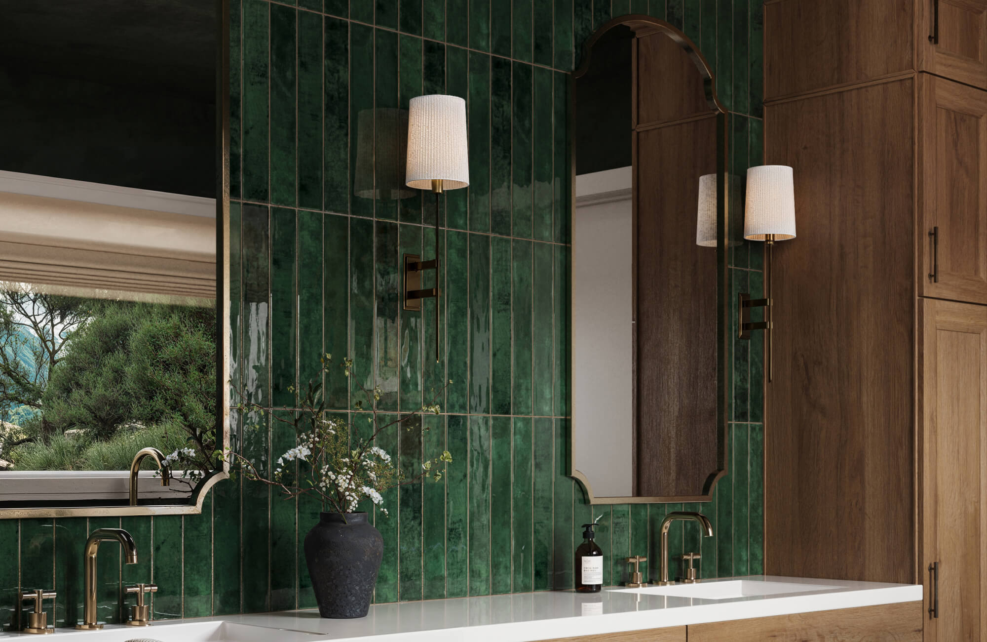 null A dramatic bathroom featuring deep green glossy subway tiles, brass fixtures, and warm wood cabinetry, accented by sconce lighting and natural decor.