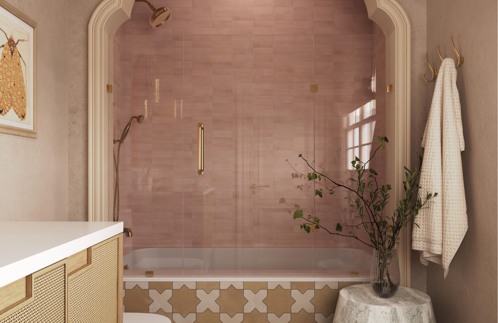 Blush pink ceramic tiles bring soft elegance to this arched shower alcove with gold fixtures.