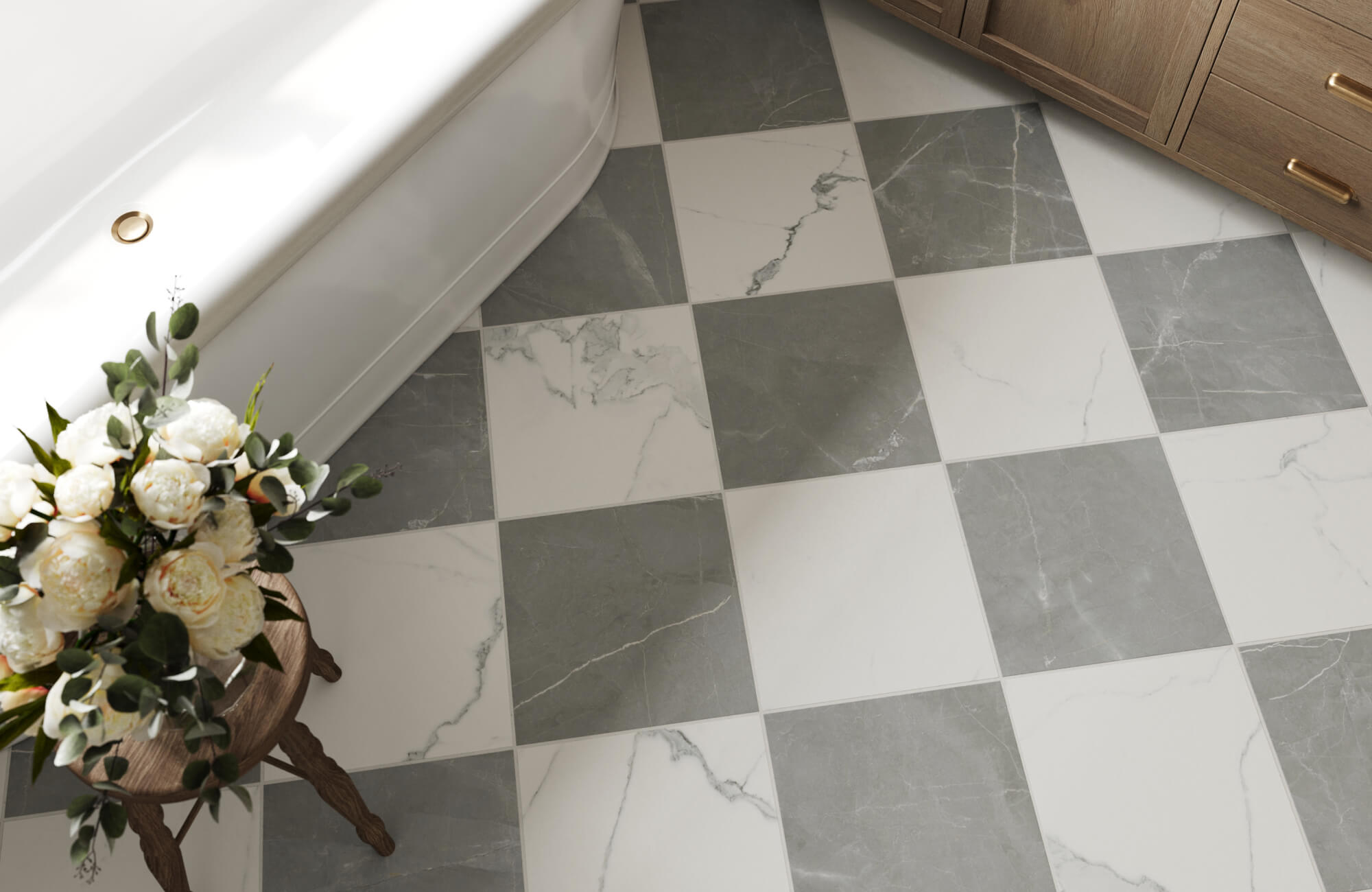 Elegant bathroom with a checkerboard floor featuring marble-look tiles, a freestanding tub, wood cabinetry, gold hardware, and a floral accent