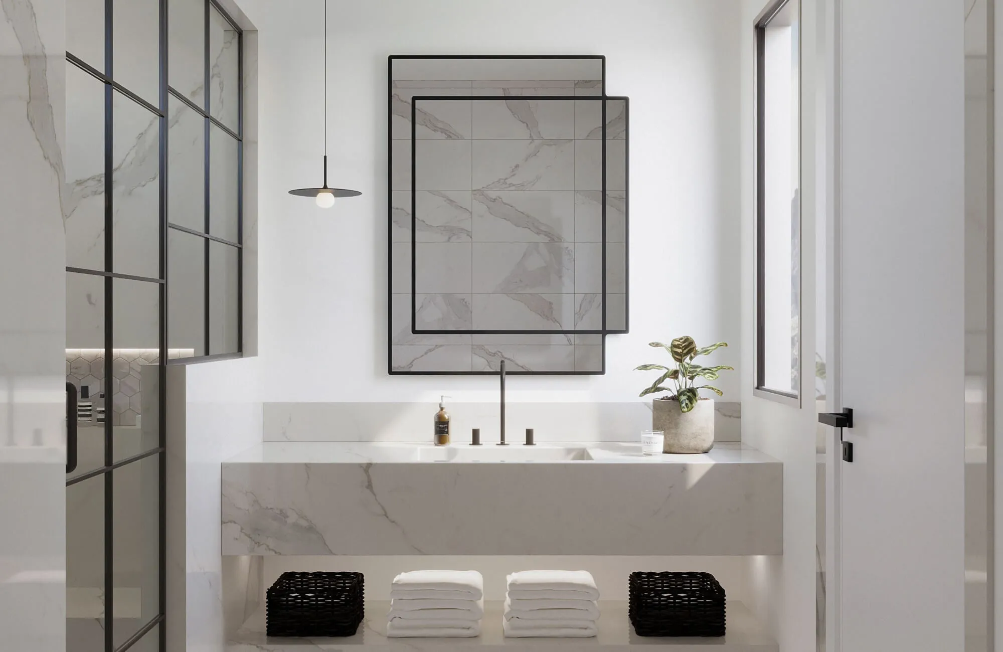 Sleek bathroom with bookmatched marble tiles and vanity, featuring minimalist black fixtures and geometric framed mirror.