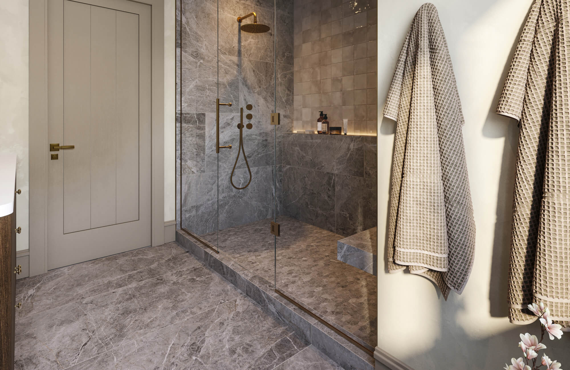 null Marble-look tiled bathroom floor and shower with glass enclosure, built-in bench, and brass shower fixtures.