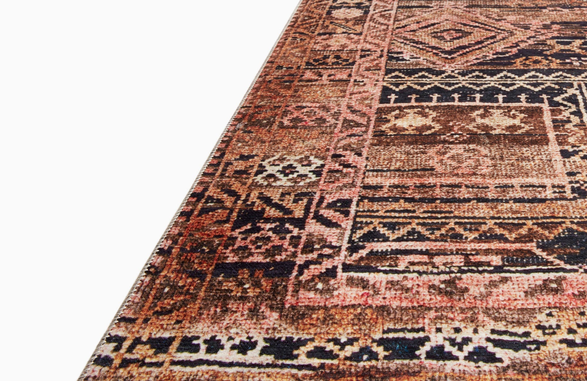 Geometric polyester outdoor rug in warm earthy tones, bringing bold patterns and color to an outdoor space.