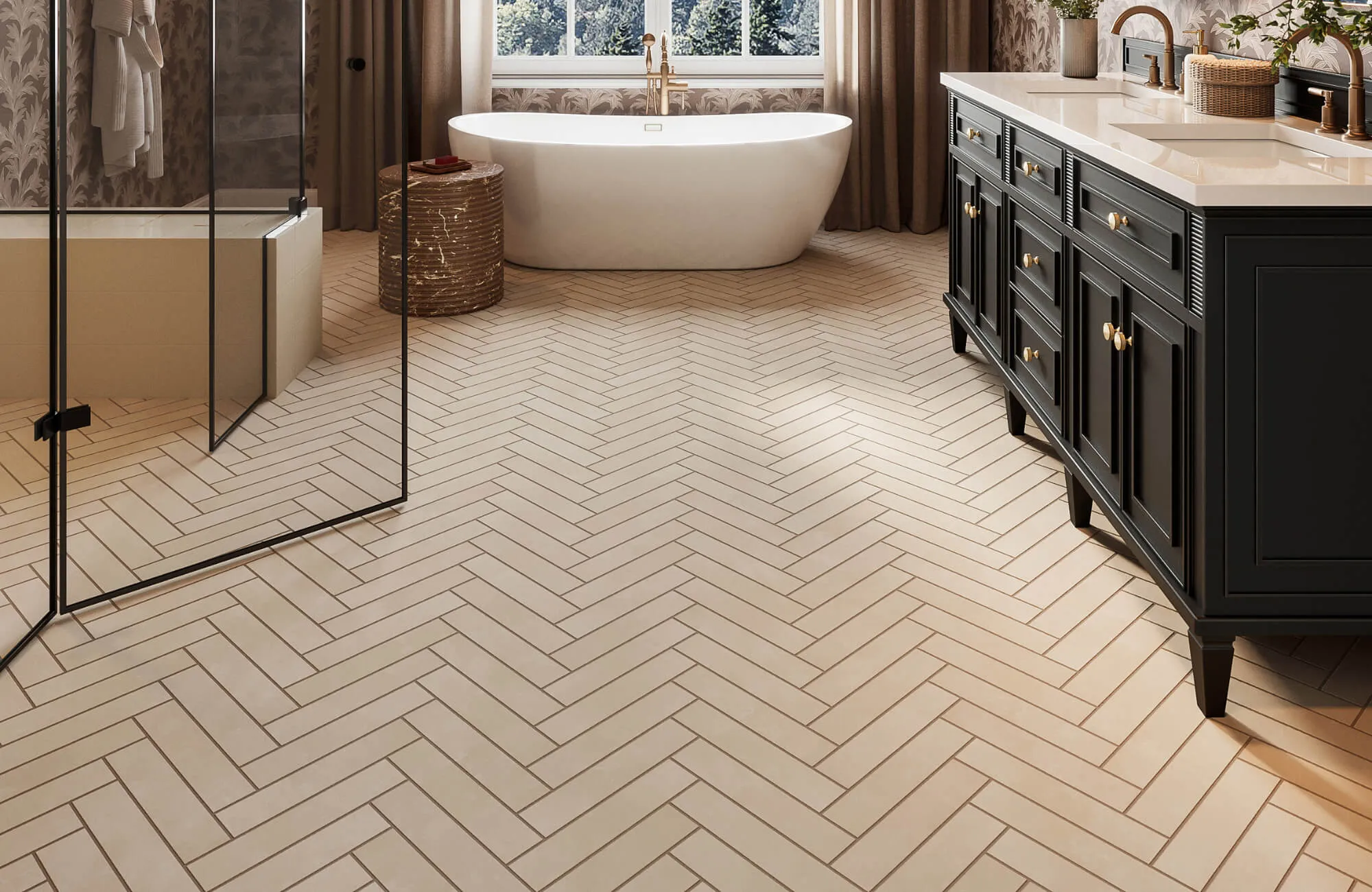Bathroom with cream herringbone tile floor, freestanding tub, glass shower, and black vanity with brass hardware.