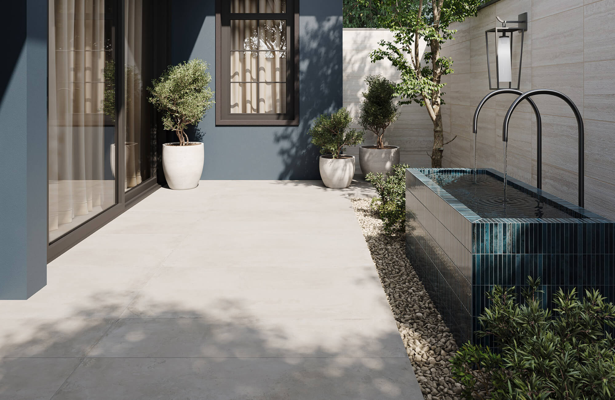 null Light-toned outdoor patio tile surrounding a water feature, creating a clean, slip-resistant surface suited for moisture-prone areas.