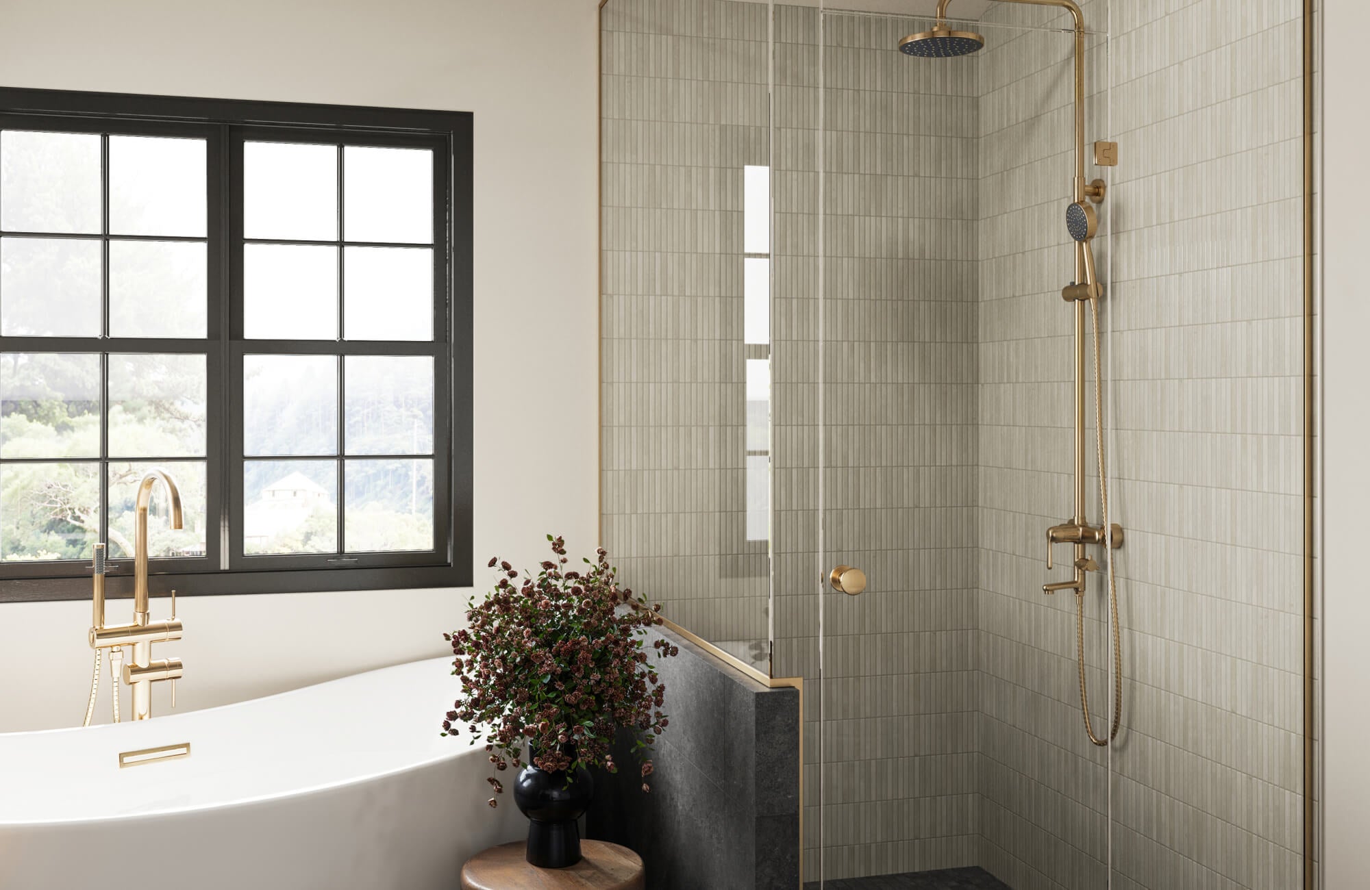 null Modern bathroom featuring vertical stacked ceramic bathroom tile in a soft beige tone, paired with a glass shower enclosure, brushed brass fixtures, and a freestanding white soaking tub.