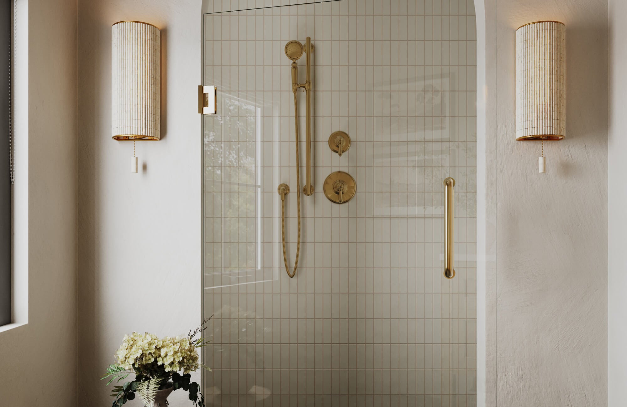 null Minimal shower space with glass enclosure, vertical tile walls, brass fixtures, and two cylindrical wall sconces flanking the entry.