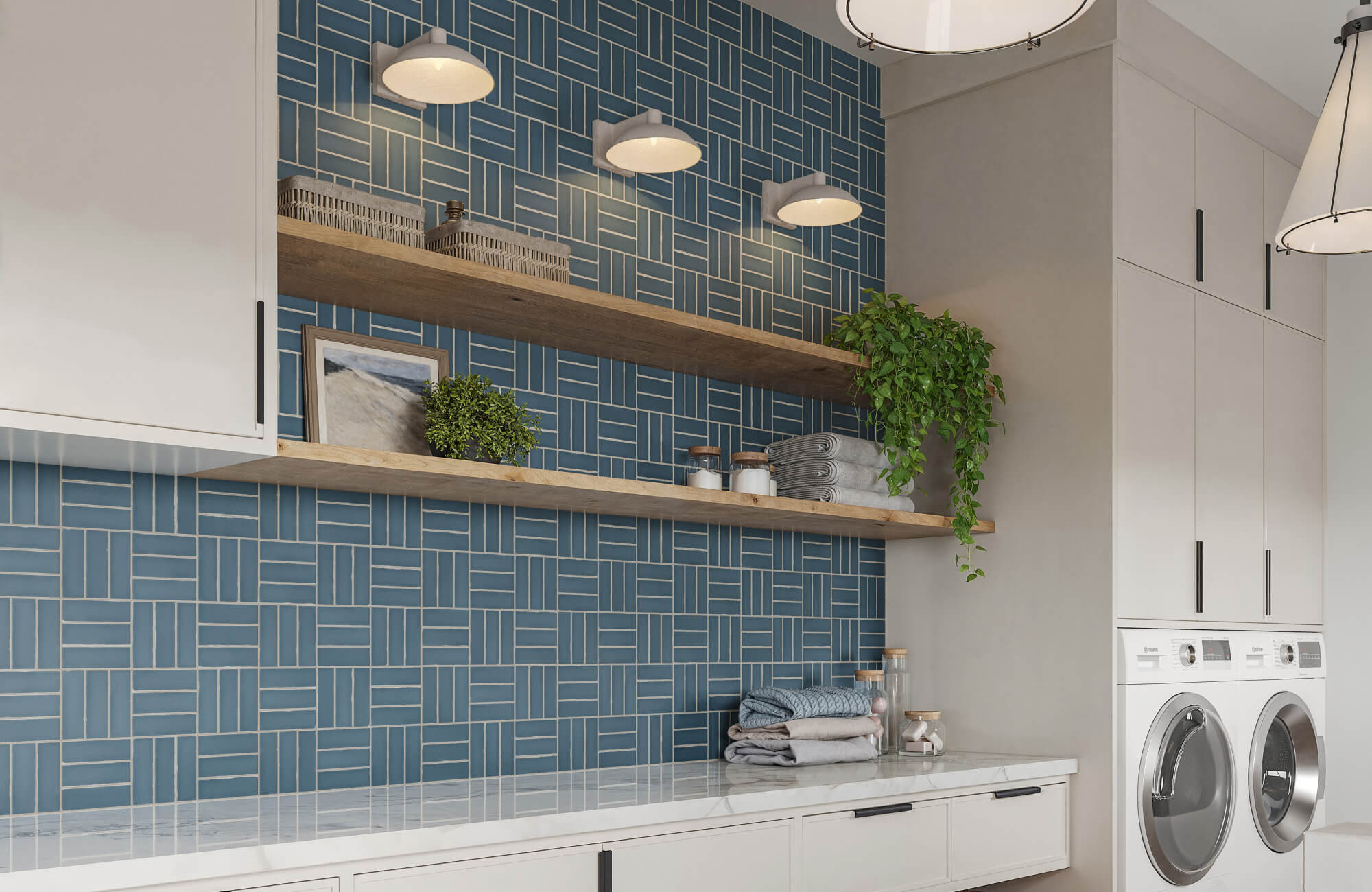 A contemporary laundry space features evenly spaced wall light fixtures with shallow, dome-shaped shades mounted above open wood shelving, casting soft, functional illumination across the textured blue tile wall.