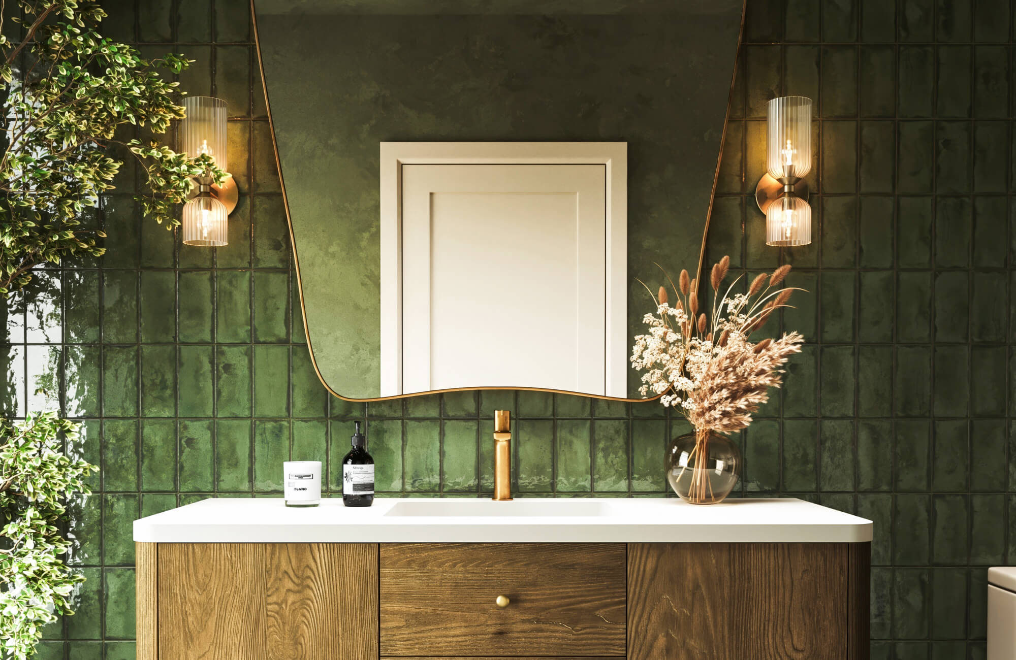 A refined bathroom showcases symmetrical wall light fixtures with ribbed glass shades and warm brass accents, flanking a softly contoured mirror to cast an inviting glow against richly textured green tile walls.
