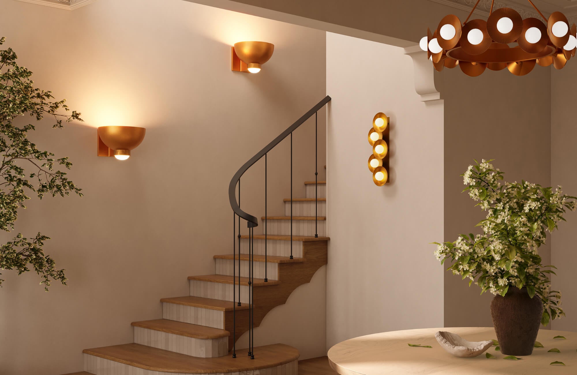 A sculptural wall light with a warm metallic finish is mounted along the staircase wall, casting soft ambient light that accentuates the curved steps, architectural details, and elegant modern interior.