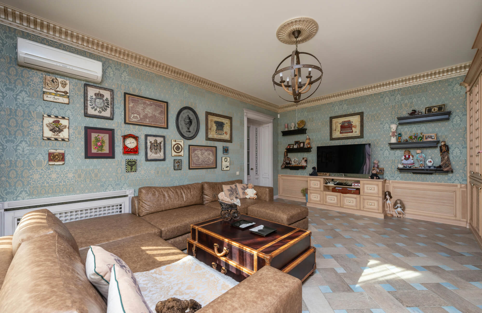 null Muted blue traditional wallpaper adds classic charm and depth to this vintage-inspired living room.