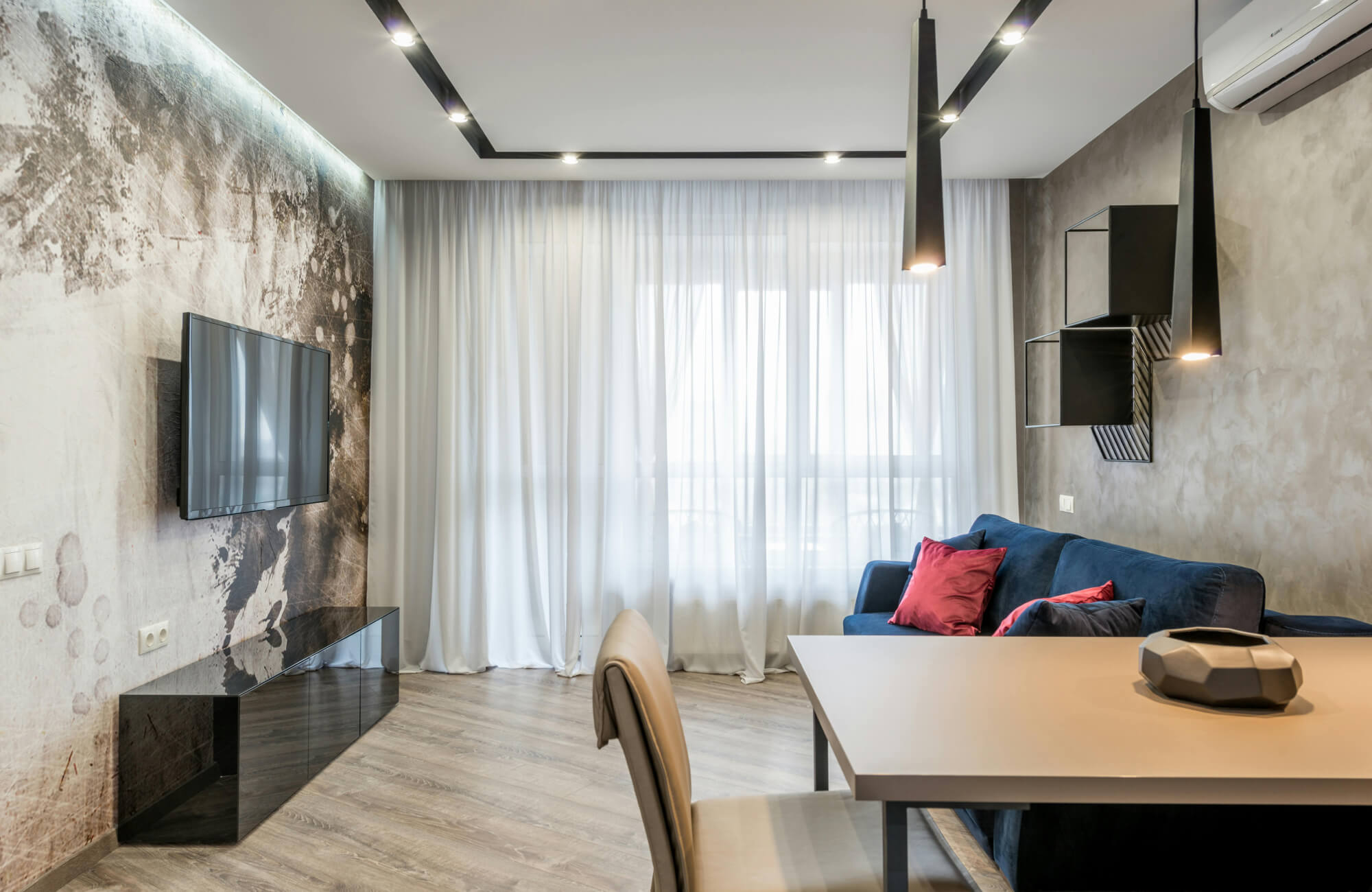 null Dramatic mural-style wallpaper adds artistic contrast to the modern living room space.