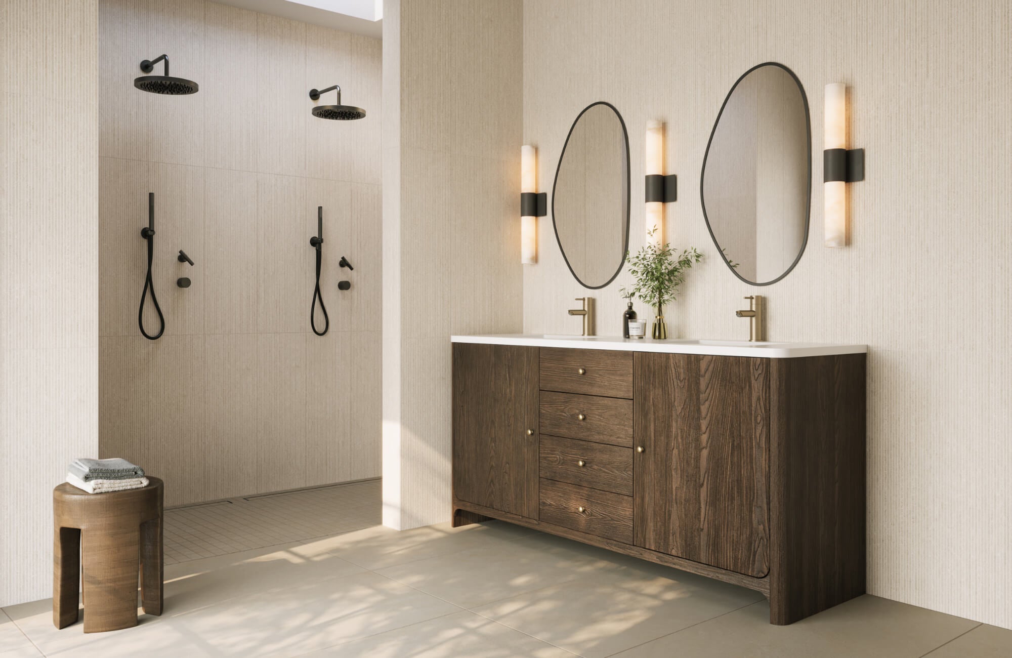 null Modern bathroom with double shower, dark wood vanity, oval mirrors, brass fixtures, and vertical wall sconces on a light textured backdrop.