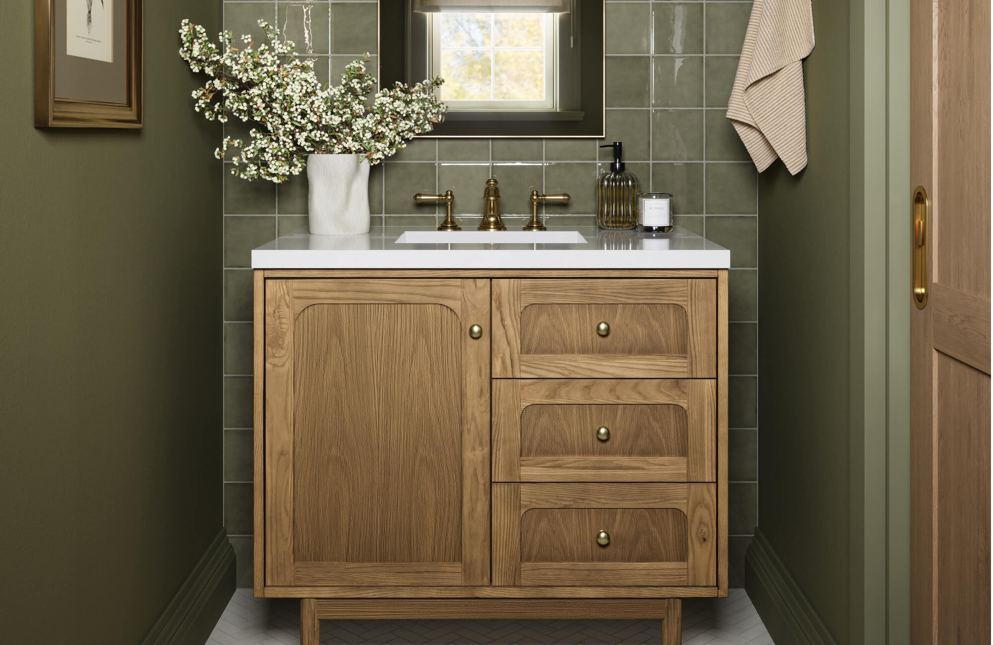 A small bathroom featuring a wood vanity with built-in drawers, green tile backsplash, and a centered sink, illustrating a practical setup for limited wall-to-wall space.