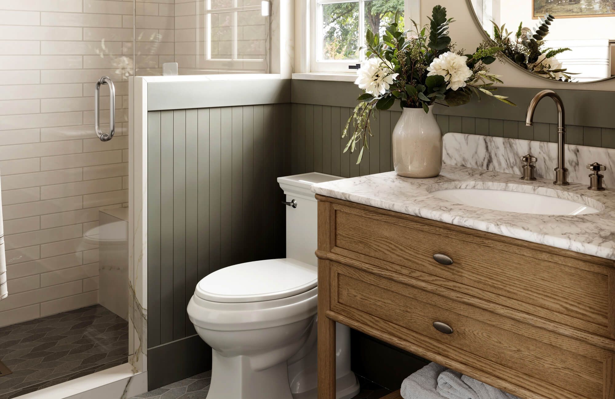 A small bathroom with a straight wood vanity and marble countertop positioned beside the toilet, showing how a standard vanity fits comfortably without using a corner layout.