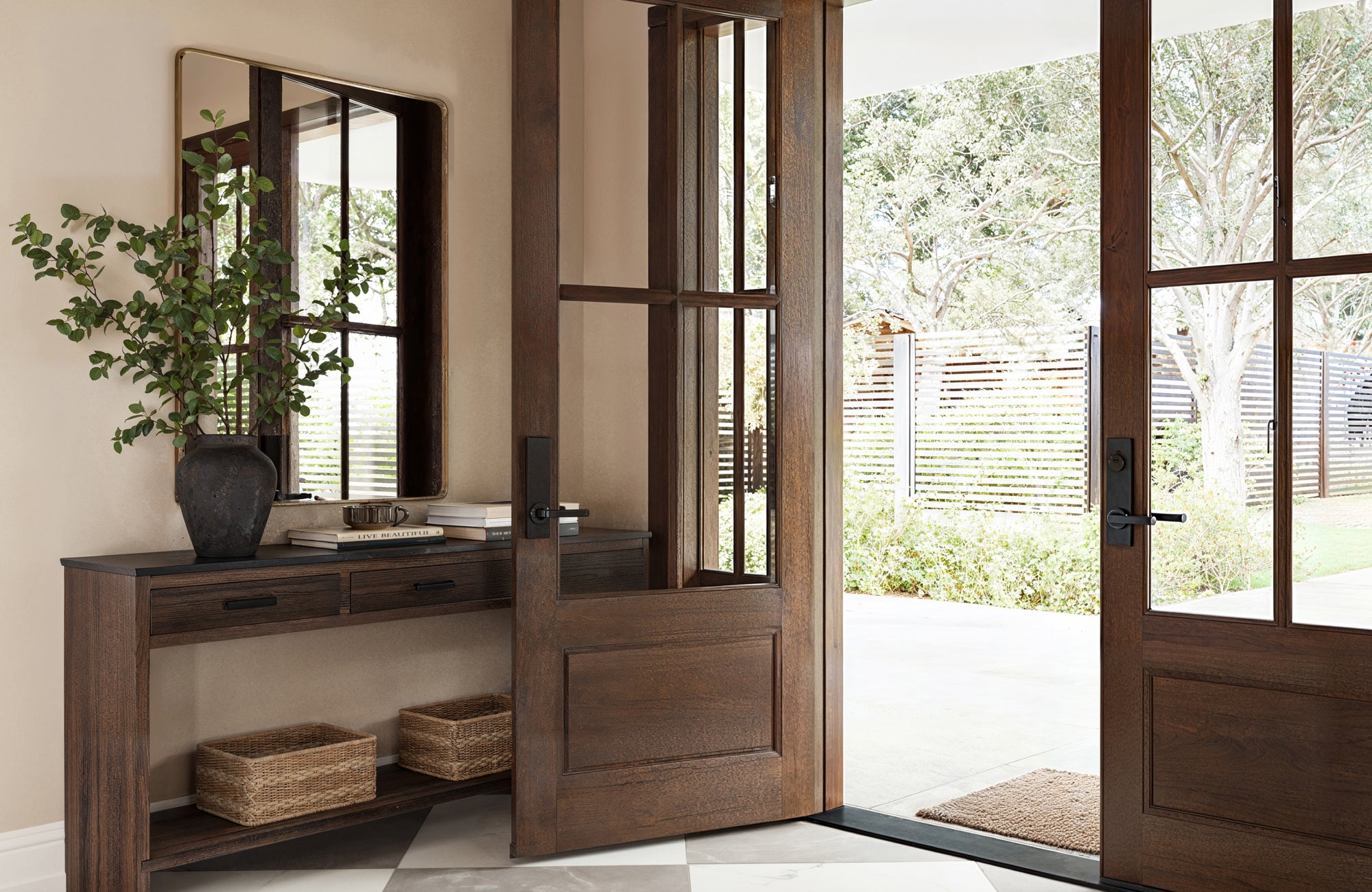 null Slim rectangular mirror placed above console table in entryway for a polished and practical first impression.