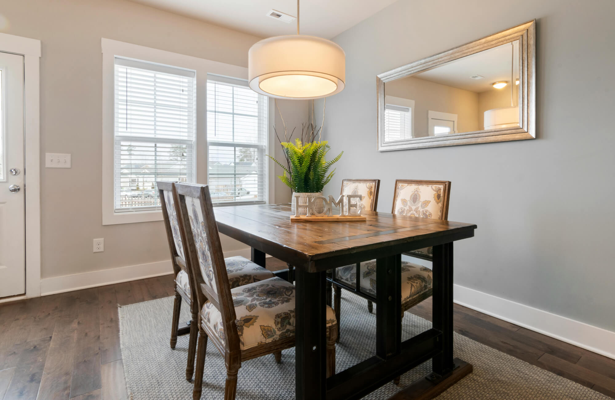 null Rectangular dining room mirror positioned to reflect the table setting, supporting harmony and a well-balanced space.