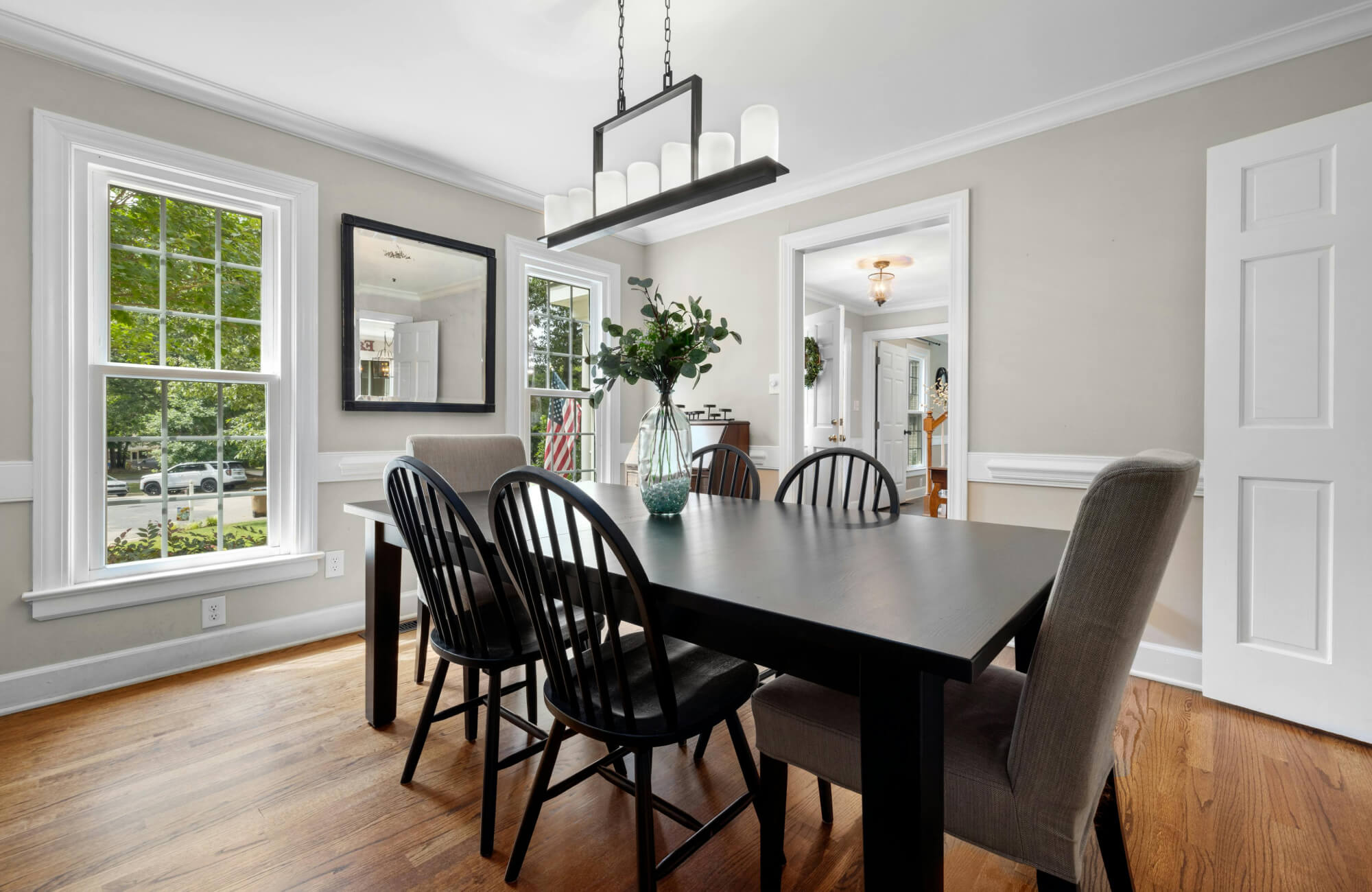null Mirror in a bright dining area reflecting openness and daylight, helping the space feel airy and welcoming.