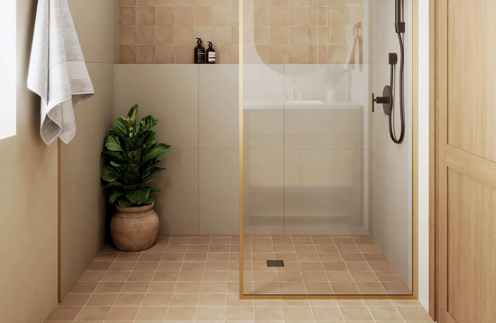 Matte beige shower tiles with a warm clay tone, paired with square floor and wall tiles, create a serene, earthy bathroom aesthetic.