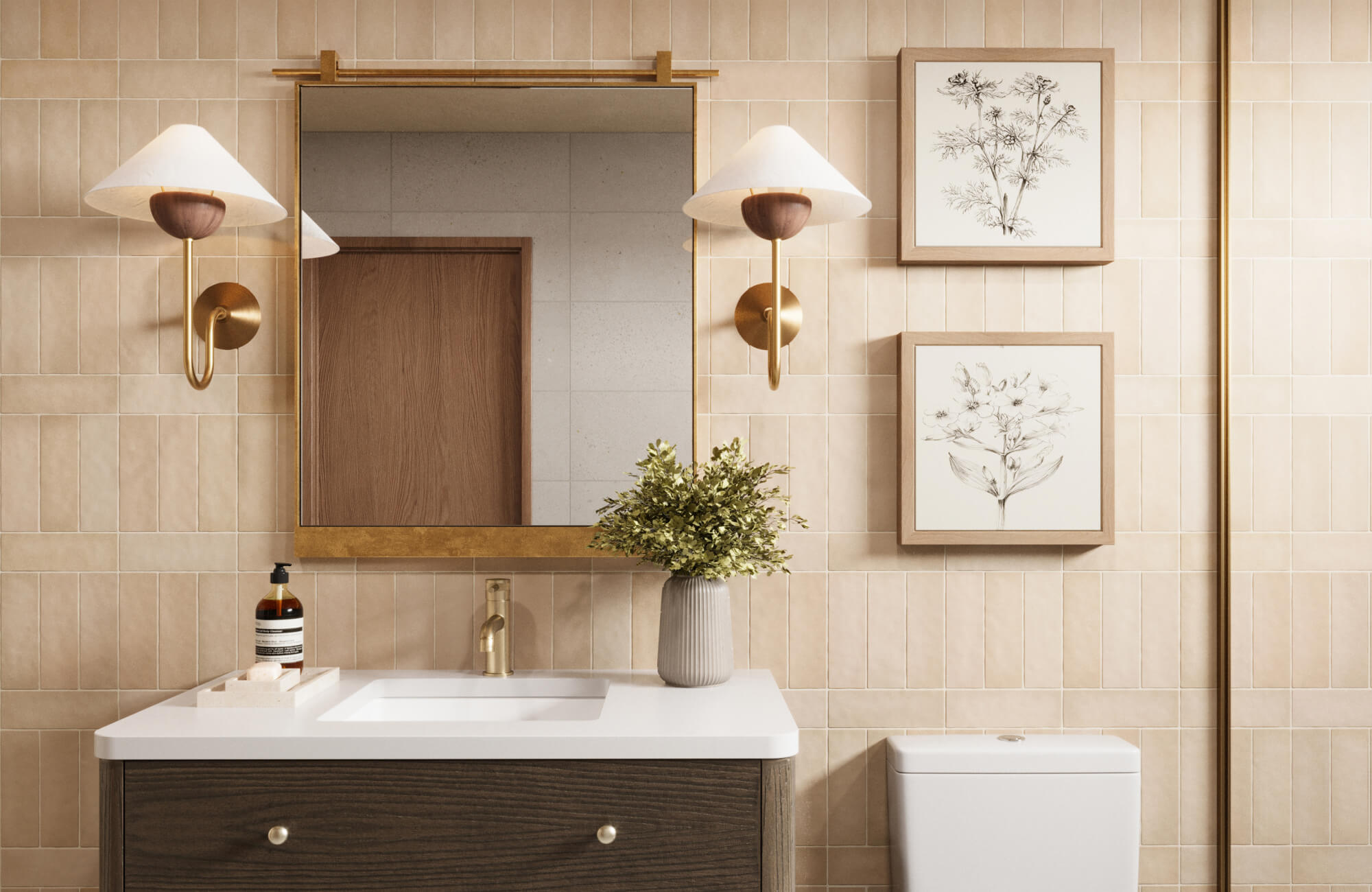 null Charming bathroom with a brass-framed square mirror on vertical beige tiles, paired with curved sconces and botanical wall art.