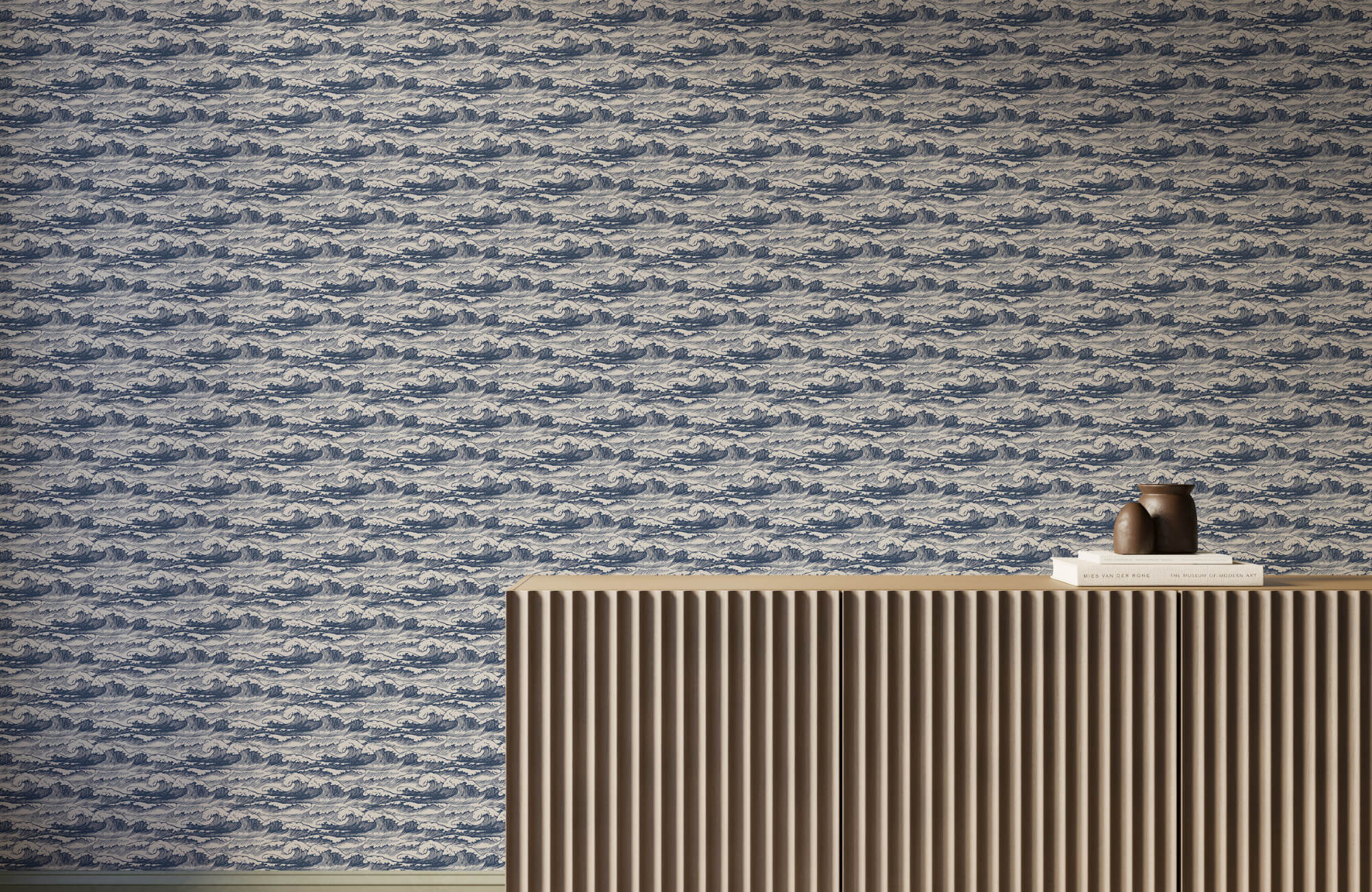 Blue wave-pattern wallpaper behind a ribbed wood console, creating a calming, fluid focal point with coastal-inspired texture.