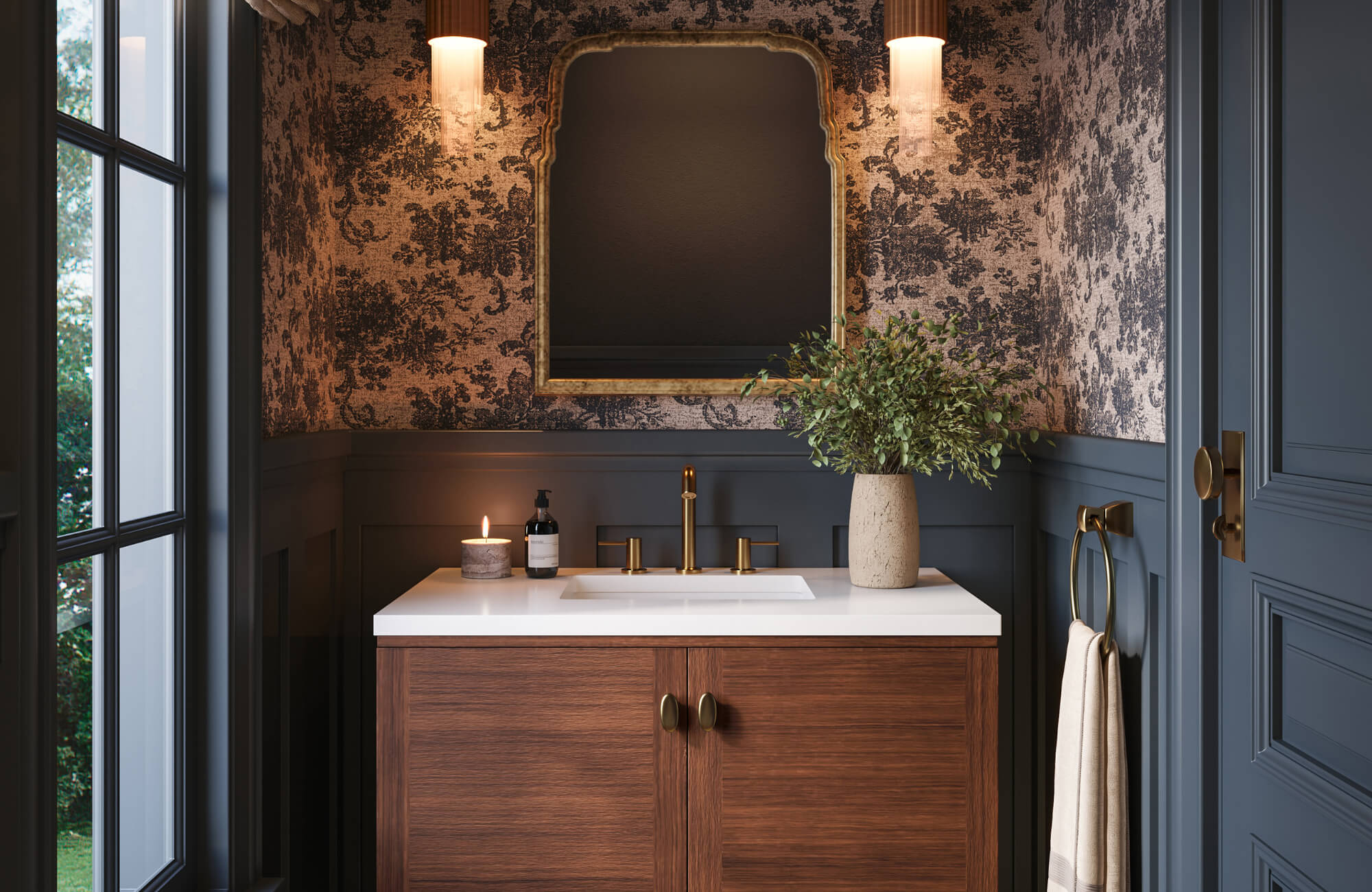 Moody powder room with dark floral wallpaper, wood vanity, and brass fixtures, creating a rich, intimate and sophisticated ambiance.