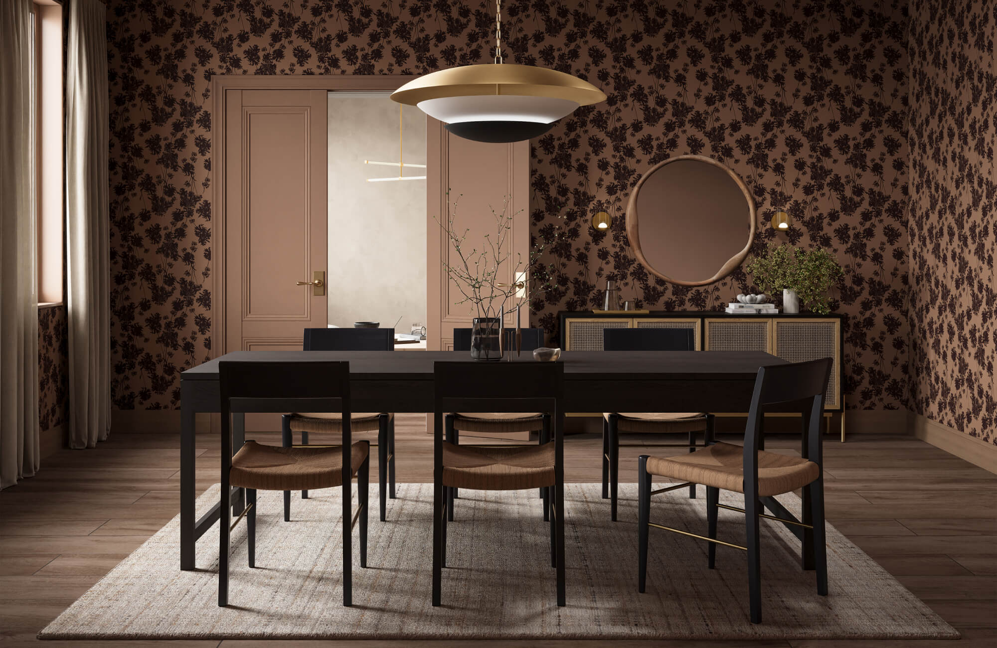 Moody dining room with dark floral wallpaper, wood table, woven chairs, and sculptural mid century modern pendant light.