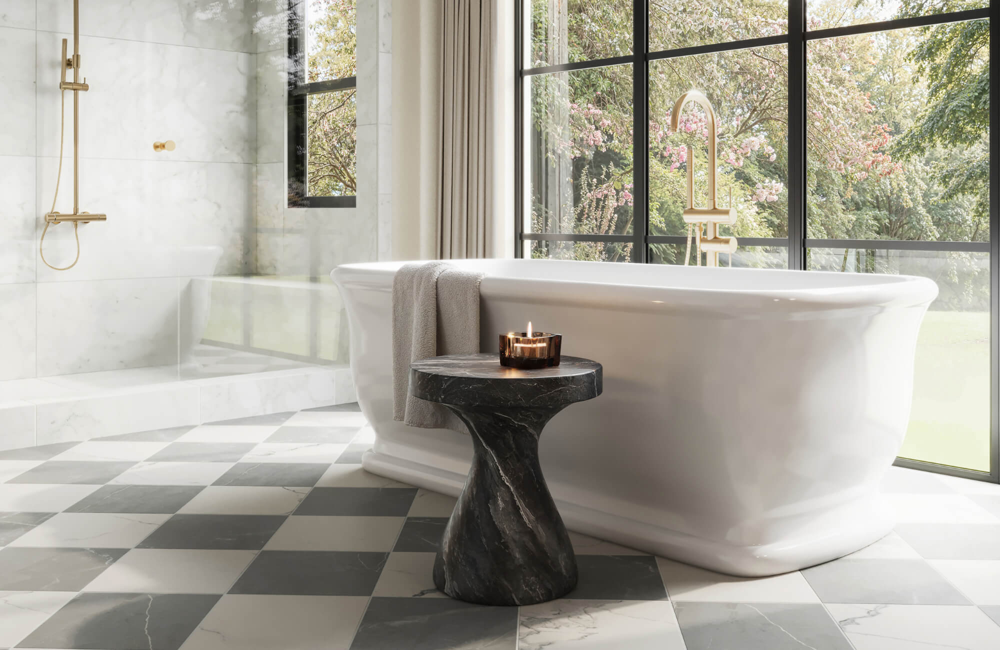 Bright bathroom with a white freestanding tub, brass shower fixtures, black-framed windows, and a matte checkerboard marble look tile floor.
