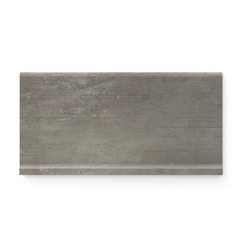 Ramsey 6x12 matte cove base tile in a sleek, modern grayish-brown tone with a smooth concrete-inspired finish