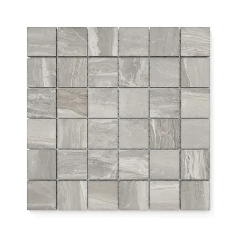 A mosaic arrangement of Harley Taupe 2x2 matte tiles, featuring earthy taupe shades and natural veining for a timeless, elegant appeal.