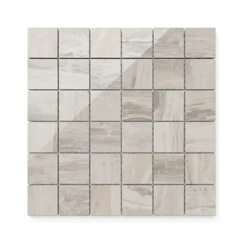 With their delicate veining and warm beige tones, these 2x2 polished mosaic tiles bring a touch of elegance and adaptability to a variety of spaces.