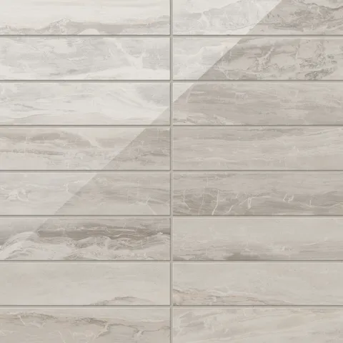 Polished beige tiles in a 3x12 format, featuring soft natural veining that adds a touch of elegance and depth to any space.